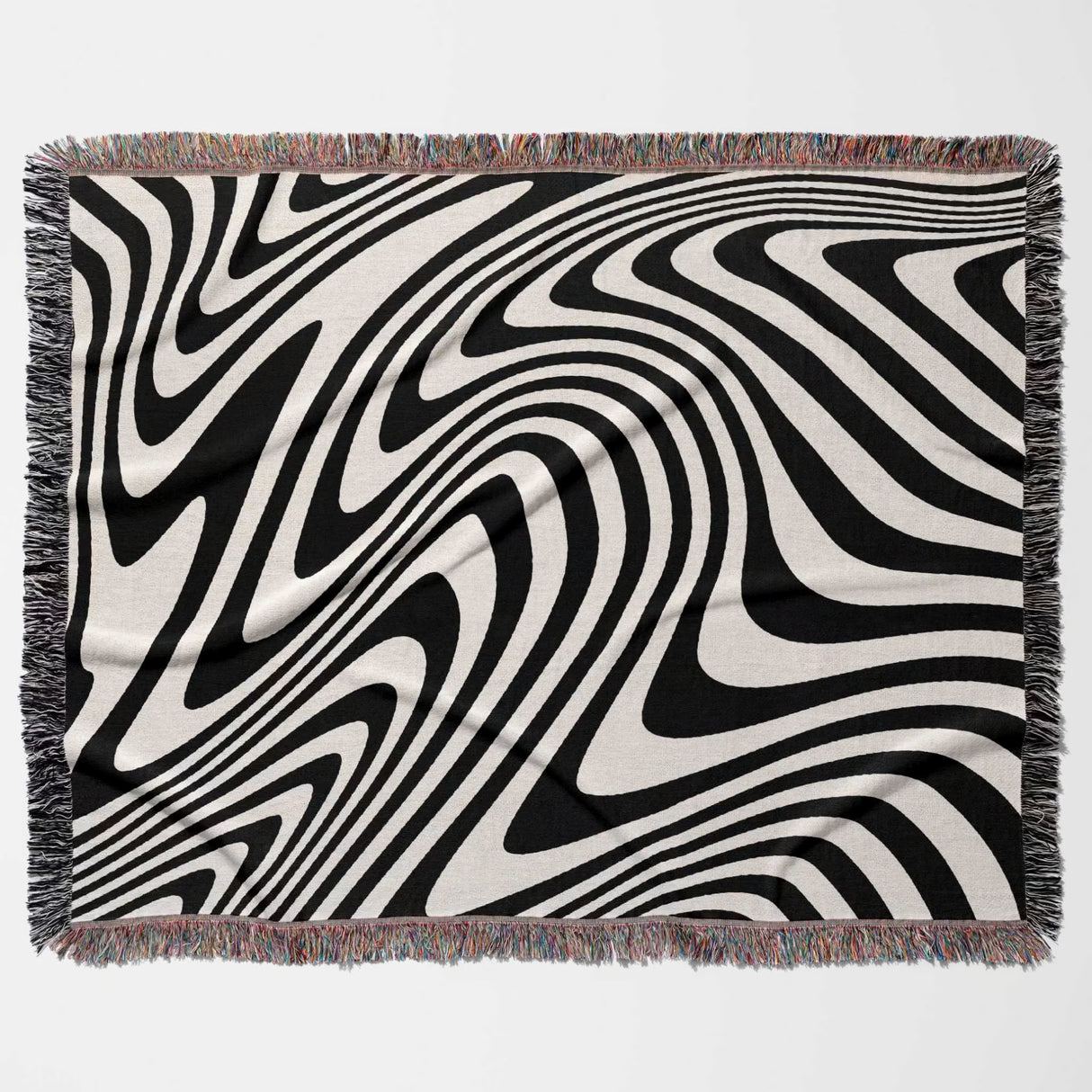 Black and white modern decorative woven throw blanket with fringed edges on a white background