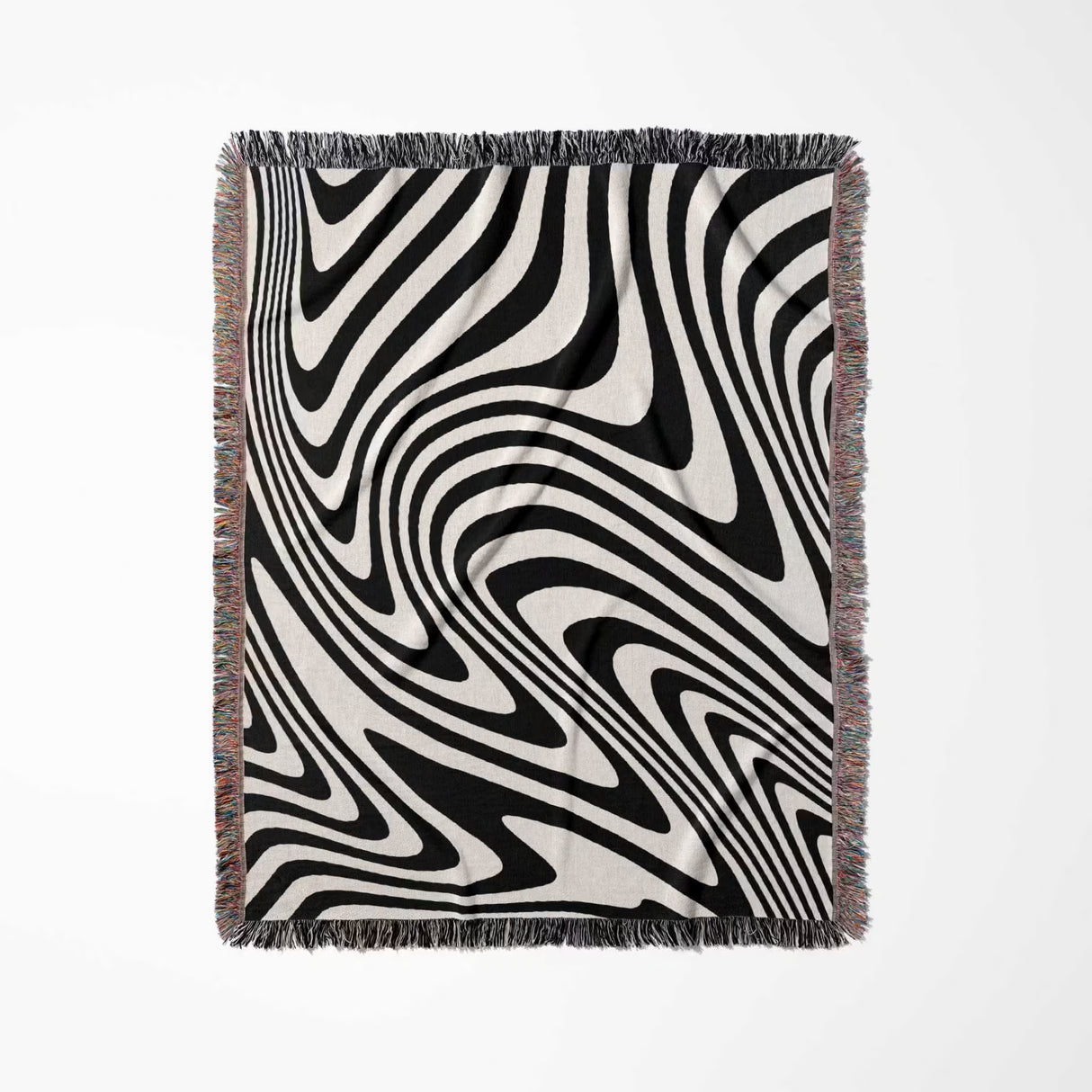 Black and white modern decorative woven throw blanket with fringes on a light gray background