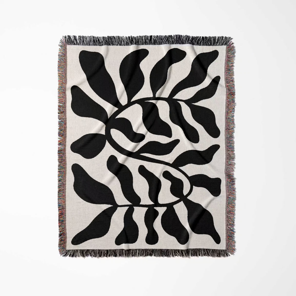 Black leaf Matisse throw blanket vertically flat on a white background