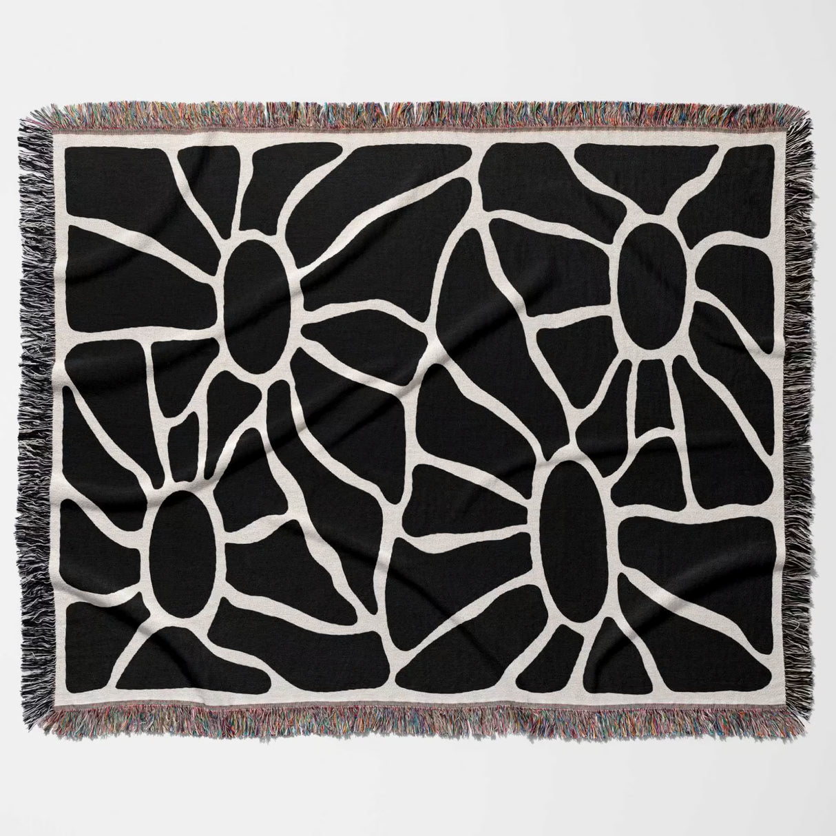 black and white Matisse tapestry throw blanket for couch with fringe horizontally flat on a white background