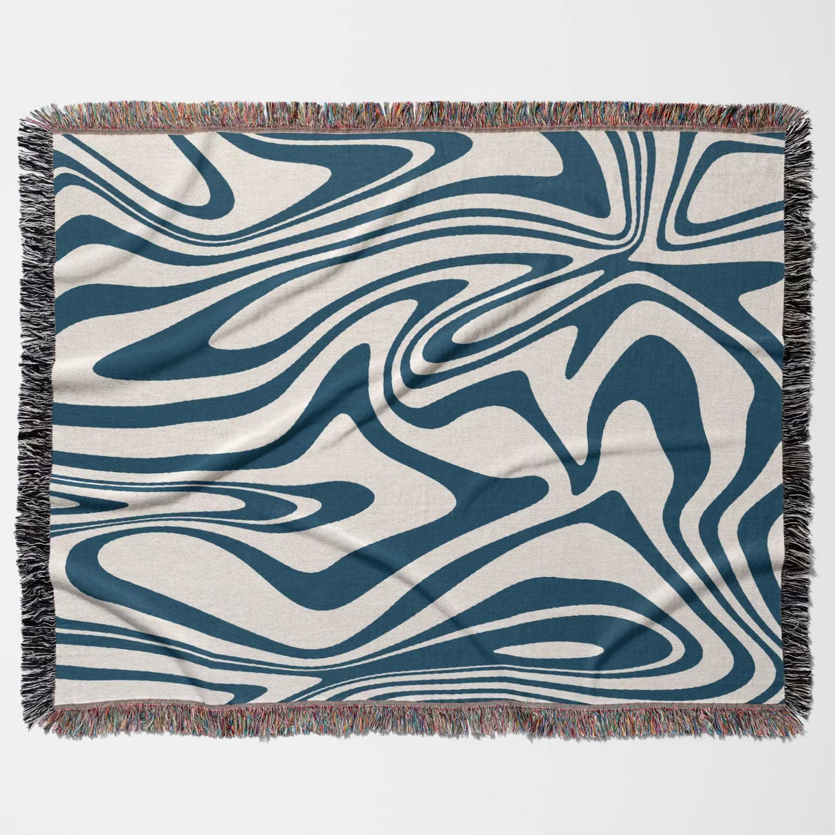 Abstract patterned blue marble woven throw blanket for couch on a beige background