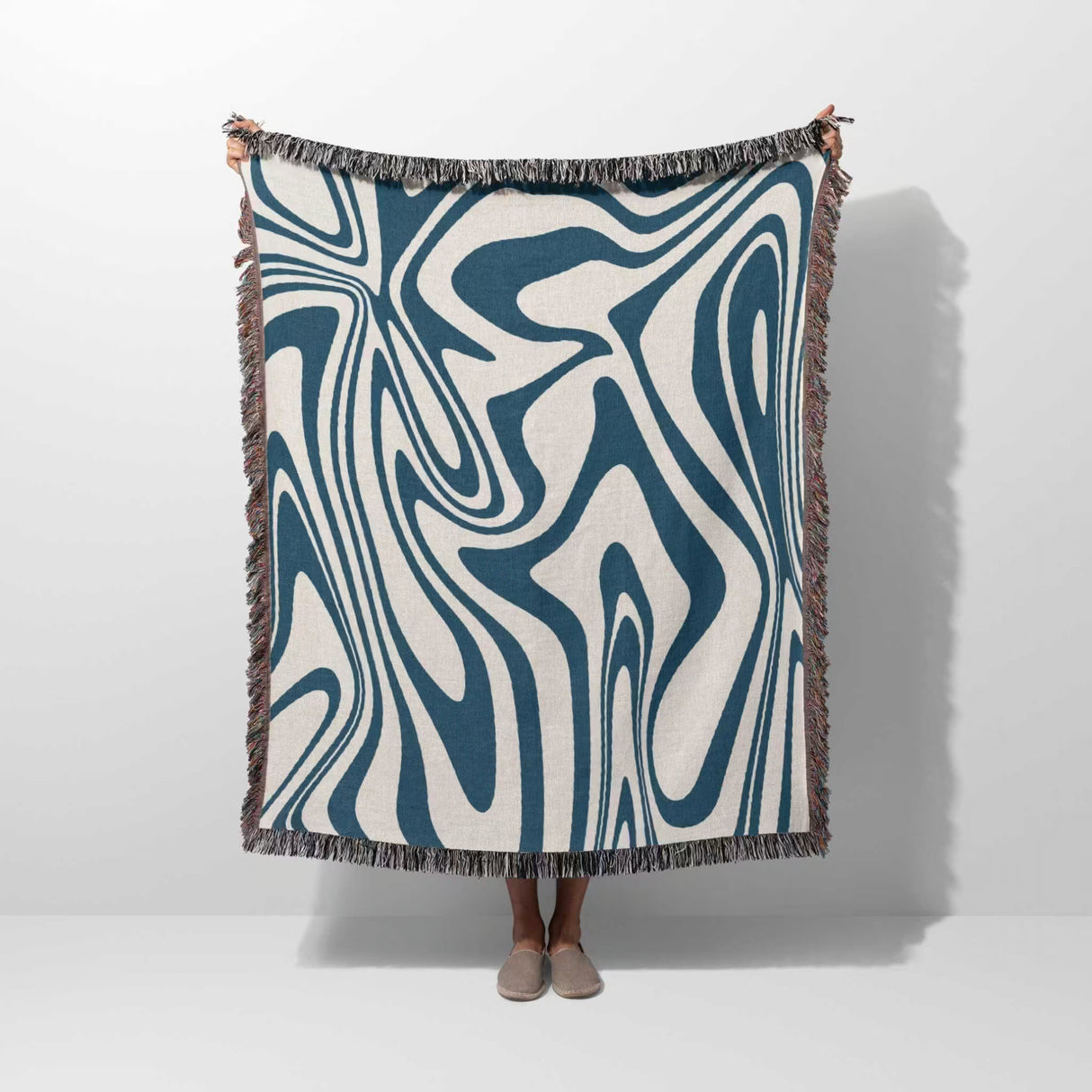 Abstract blue marble woven throw blanket for couch on a white background