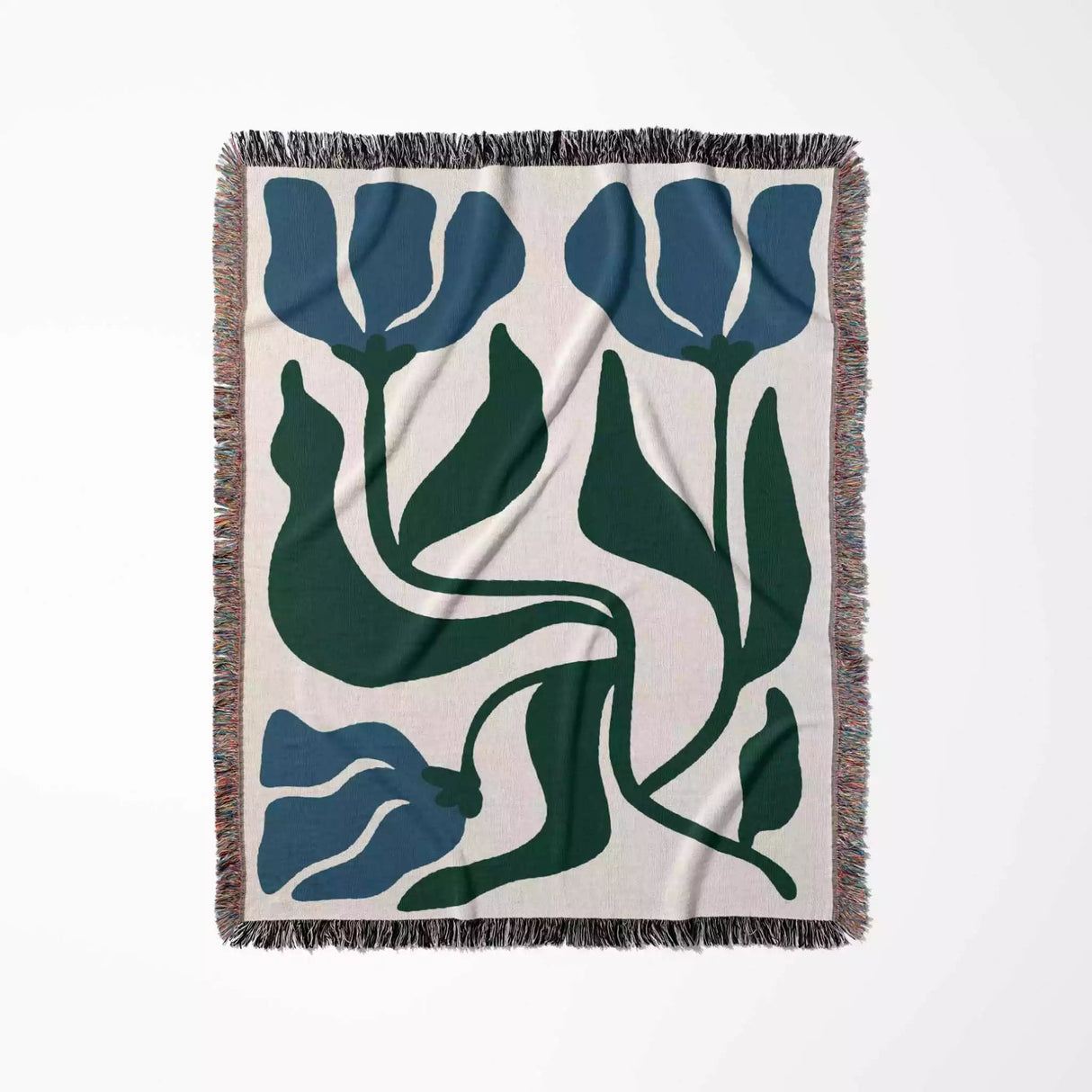 Decorative blue and green Matisse flower woven throw blanket with blue and green tulip pattern on a white background