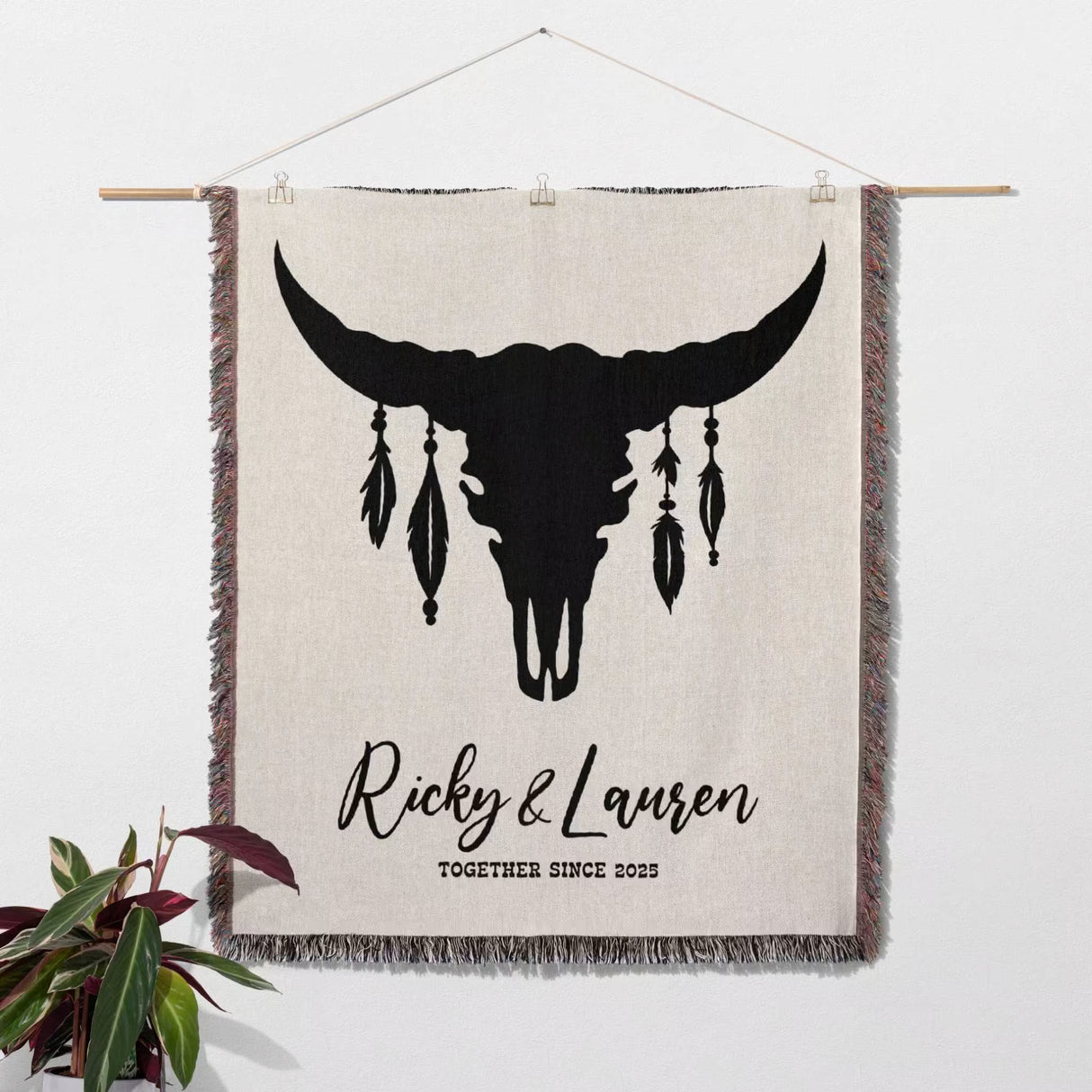 Bull skull boho wedding cotton anniversary gift – woven throw blanket with bull skull design and personalized text on a white wall.