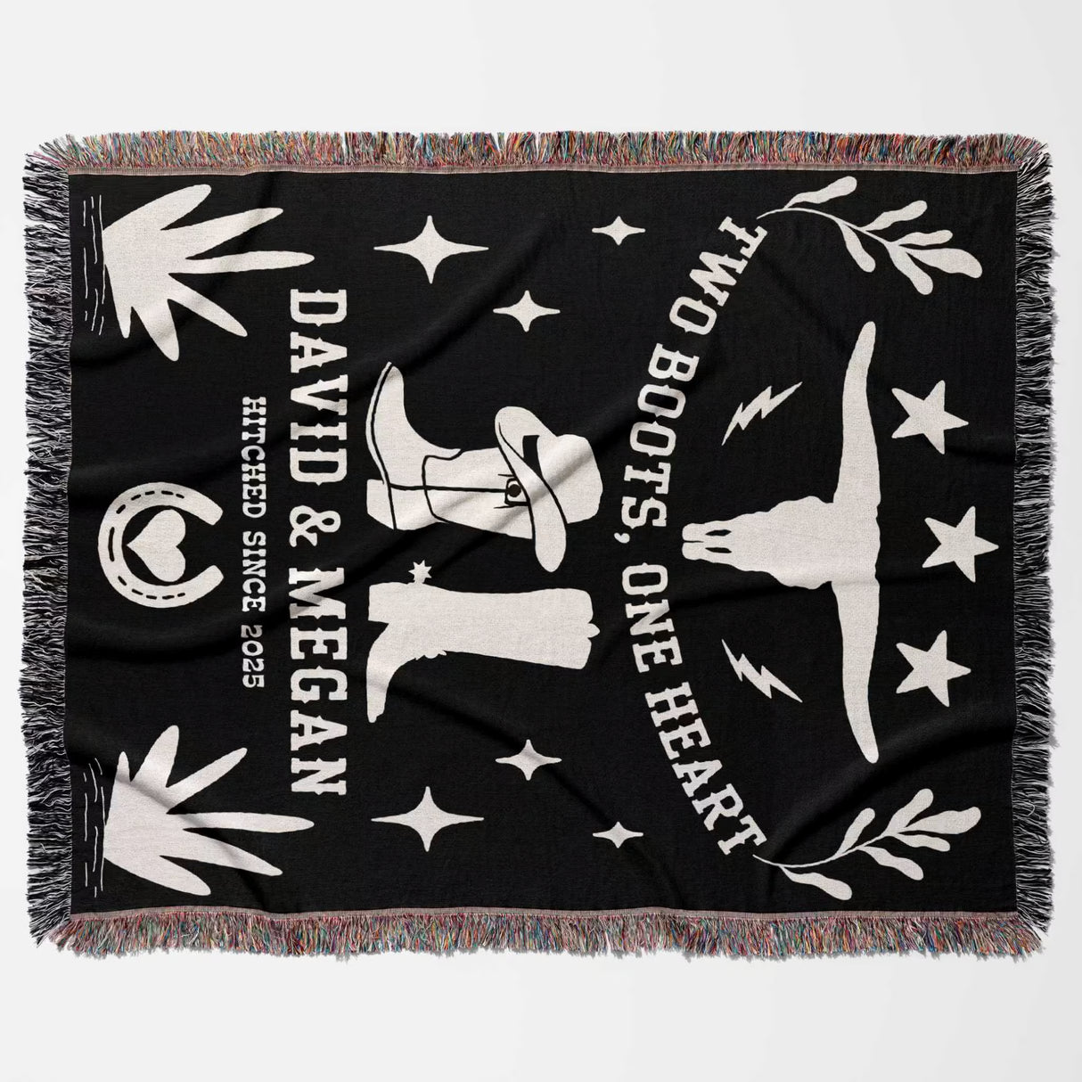 Cow skull and boots 2nd anniversary gift woven throw blanket flat lay with white graphics and text, featuring cowboy boots and stars, on a white background.