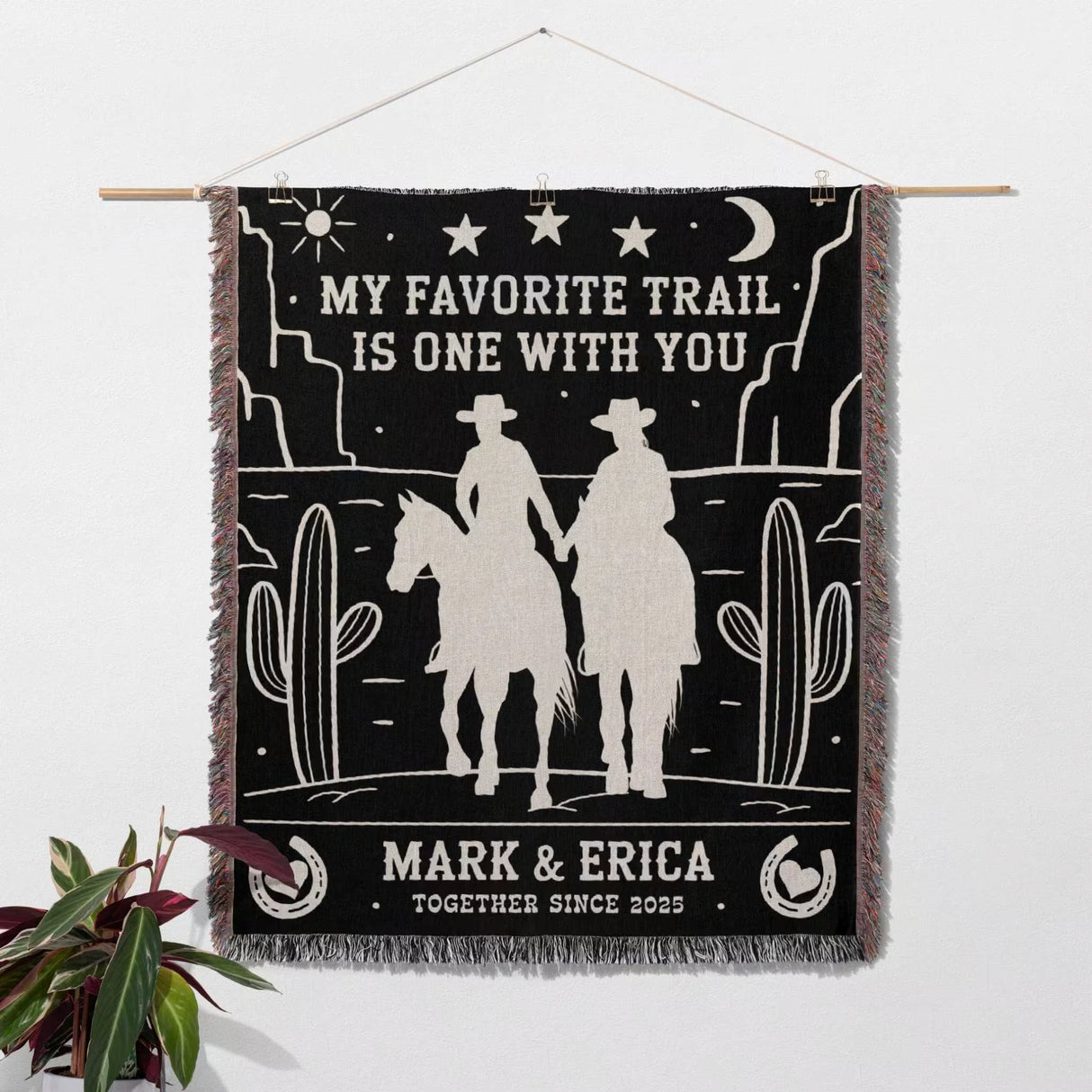 Cowboy and cowgirl couple 2nd anniversary gift woven throw blanket with cowboy design and custom text on a white background as a wall tapestry.