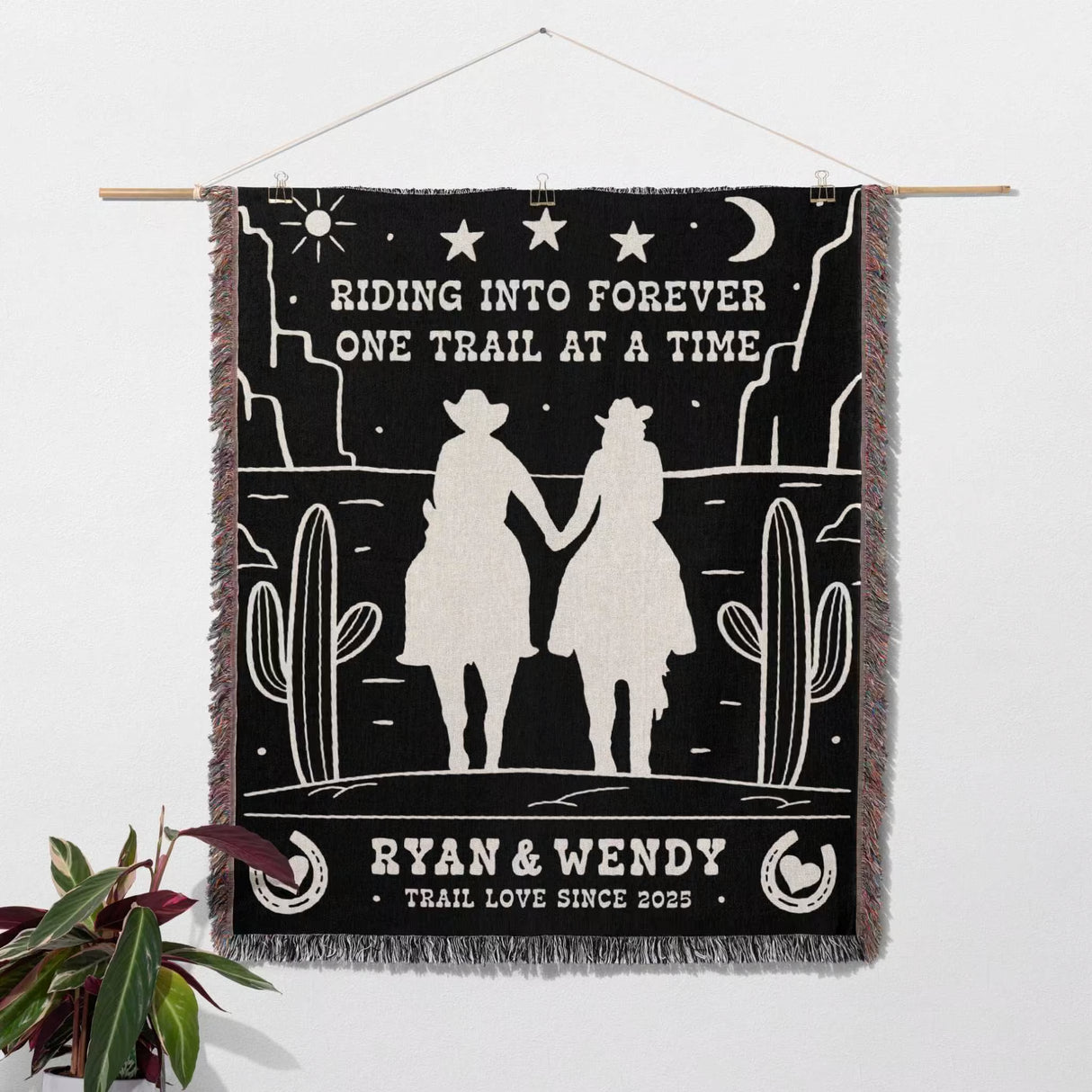 Cowboy and cowgirl western 2nd anniversary gift woven throw blanket with desert scene design, couple holding hands, and custom text as a wall tapestry.