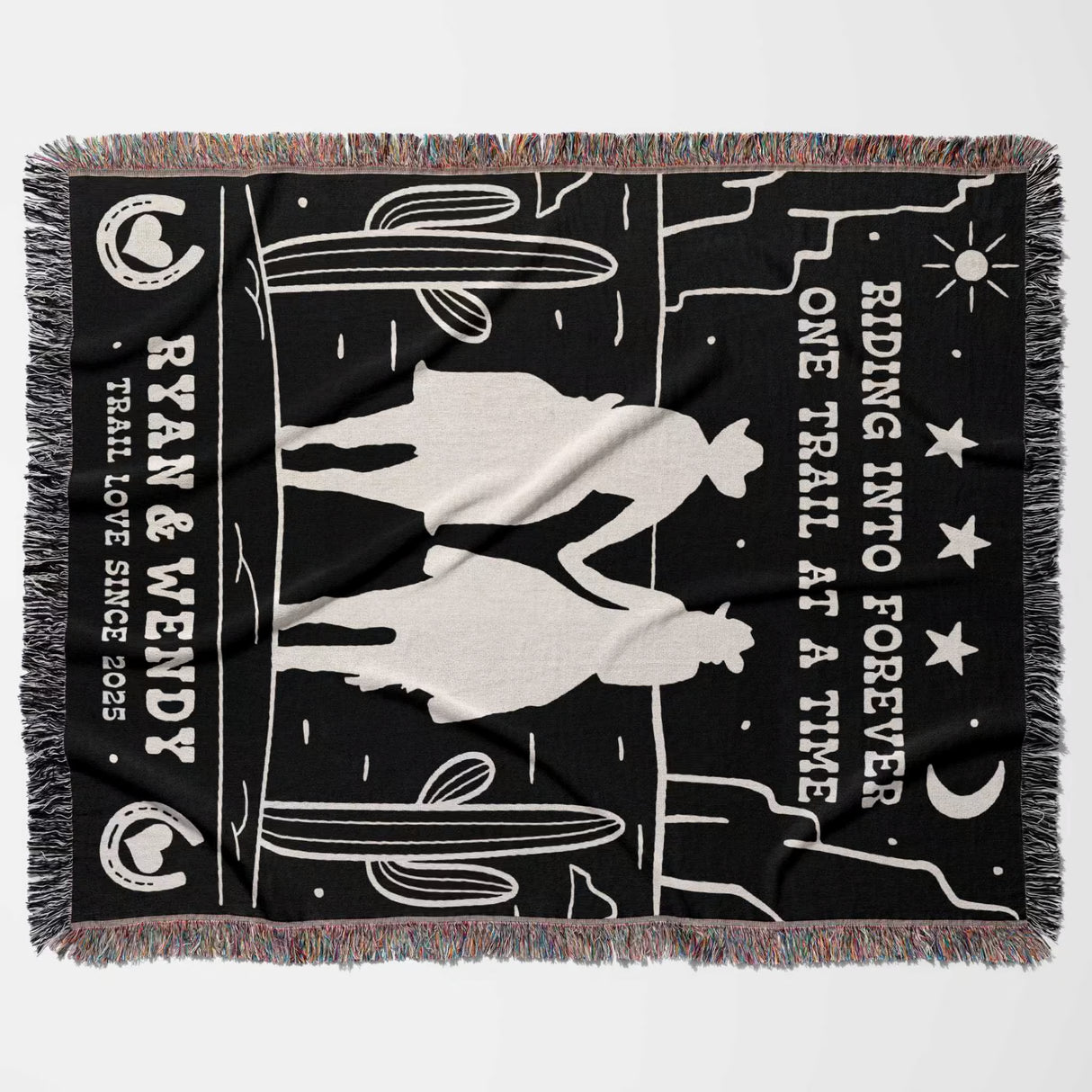 Cowboy and cowgirl western 2nd anniversary gift woven throw blanket flat lay with horse design and text on a black background