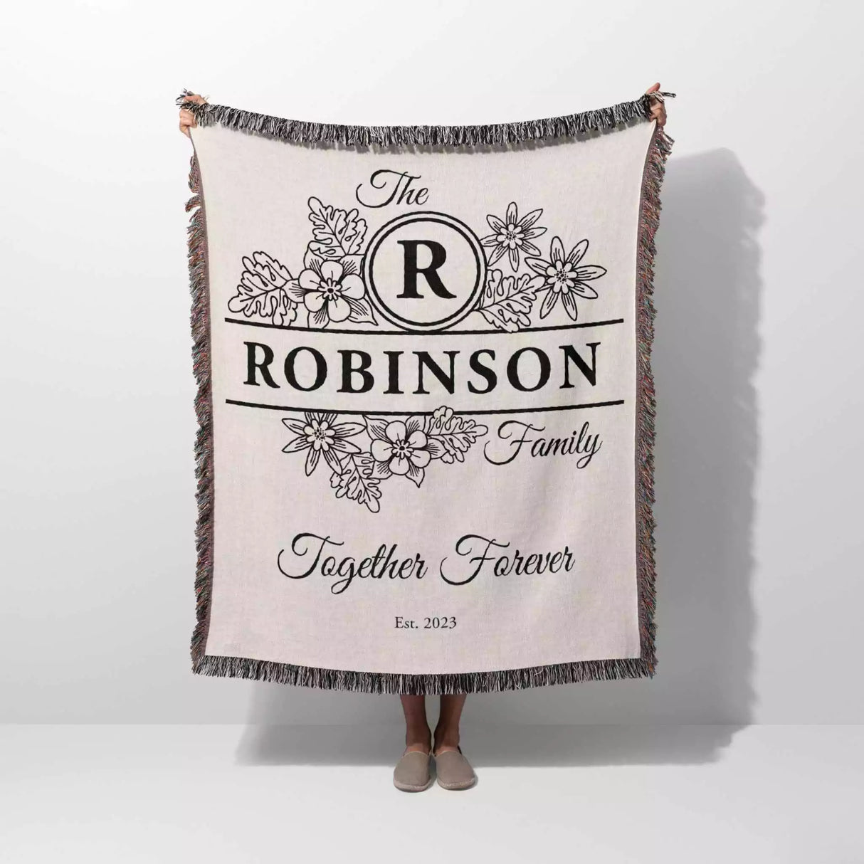 Custom last name cotton blanket with 'The Robinson Family Together Forever' text and floral design on a white background