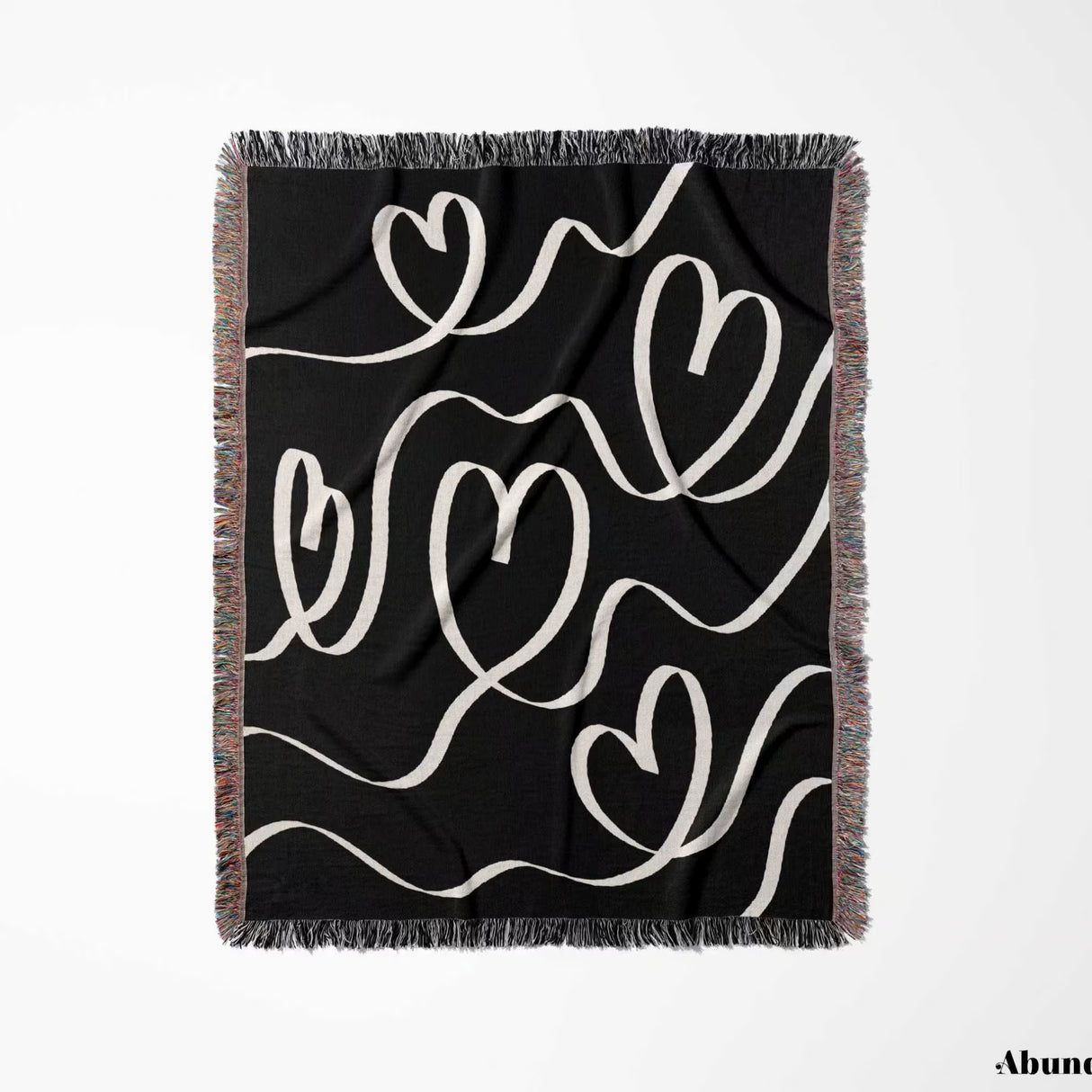 Black and white decorative hearts woven blanket throw full view on a white background