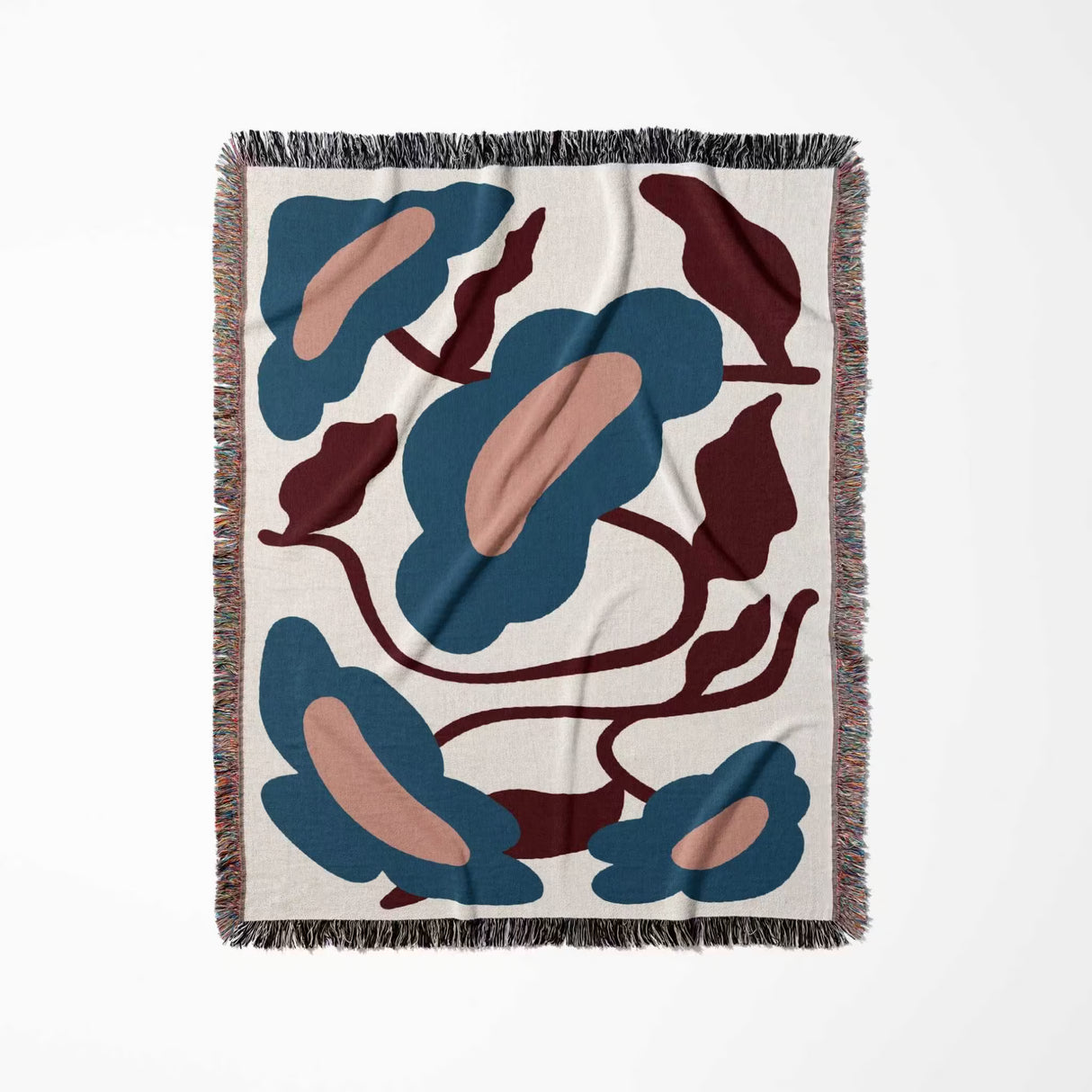 Decorative floral Matisse inspired tapestry throw blanket for couch with abstract leaf pattern vertically flat on a white background
