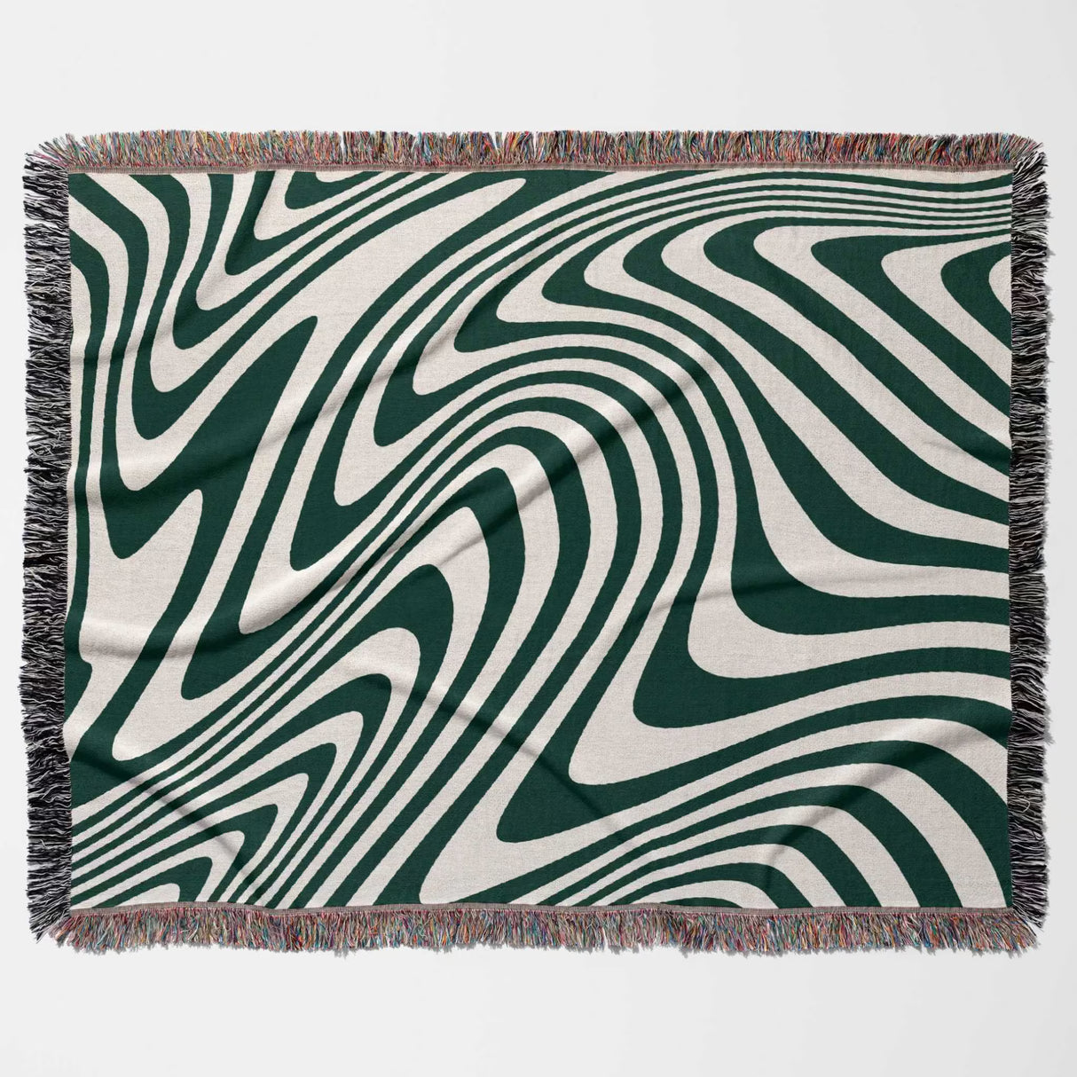 Forest green modern decorative woven throw blanket with green and white abstract pattern on a plain background