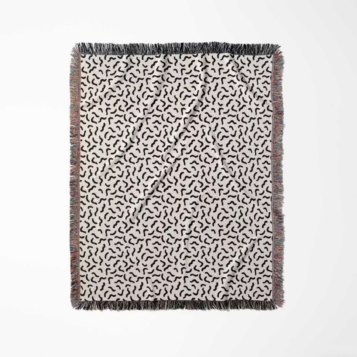 Funky squiggly woven blanket throw tapestry with fringe full view on a white background