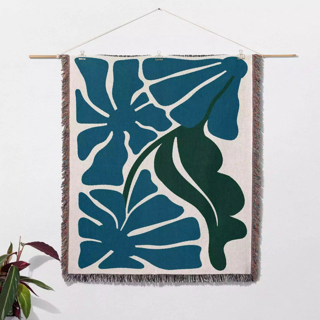 Henri Matisse blue flowers woven throw blanket as woven wall art with blue and green leaf pattern on a white background