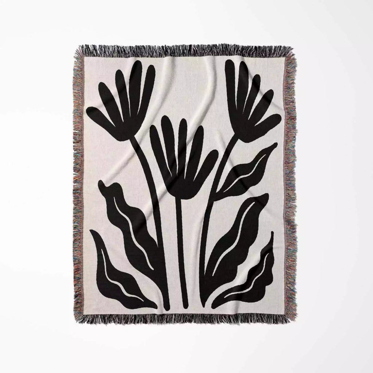 Matisse flowers black and white woven throw blanket with black floral pattern on a white background