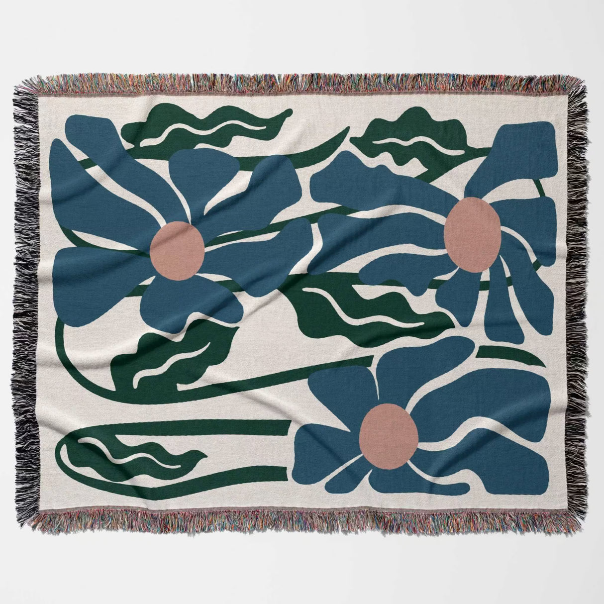 Floral patterned Matisse style blue flowers cotton woven throw blanket with blue flowers and green leaves on a beige background