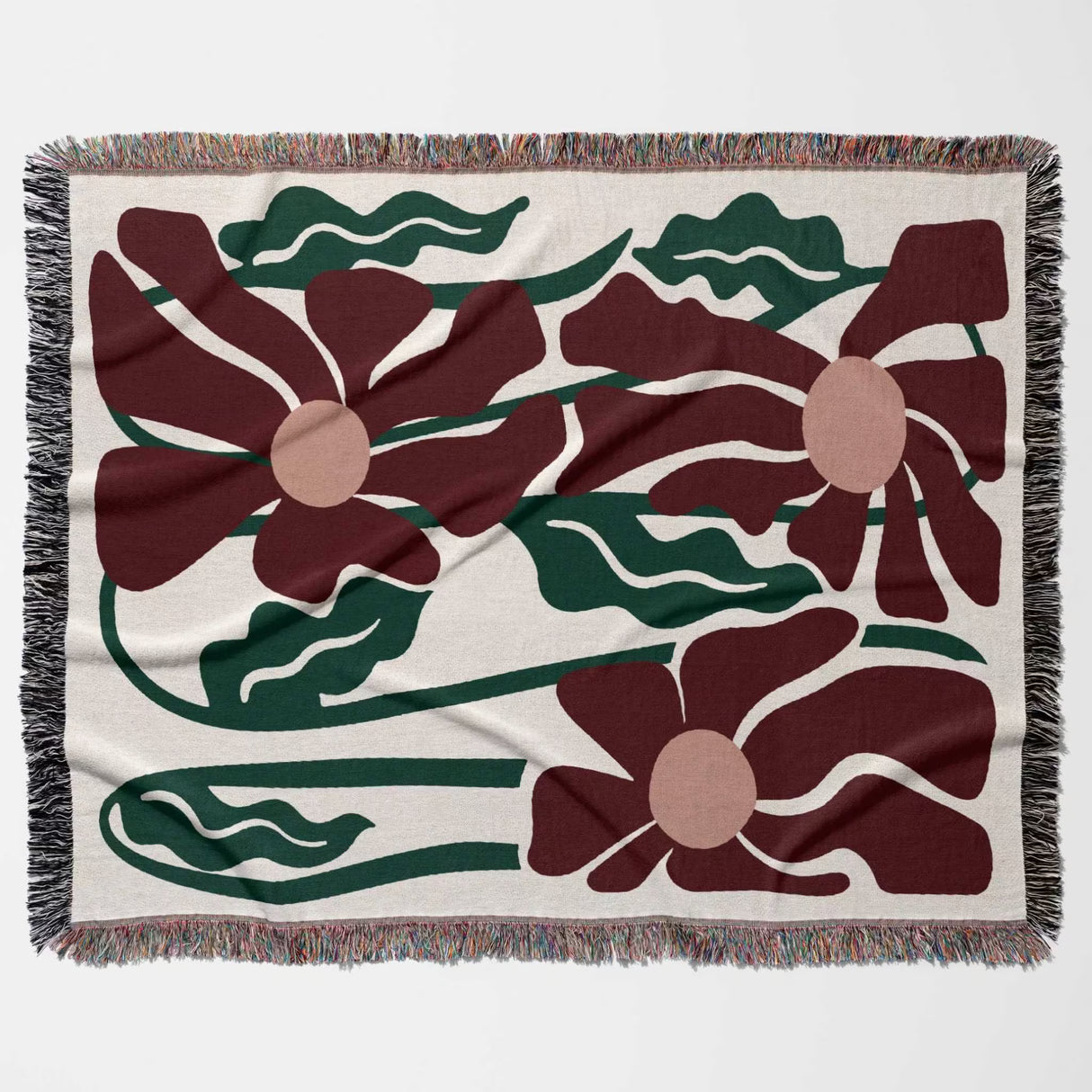 Floral patterned Matisse style blue pure cotton woven throw blanket with red flowers and green leaves on a beige background