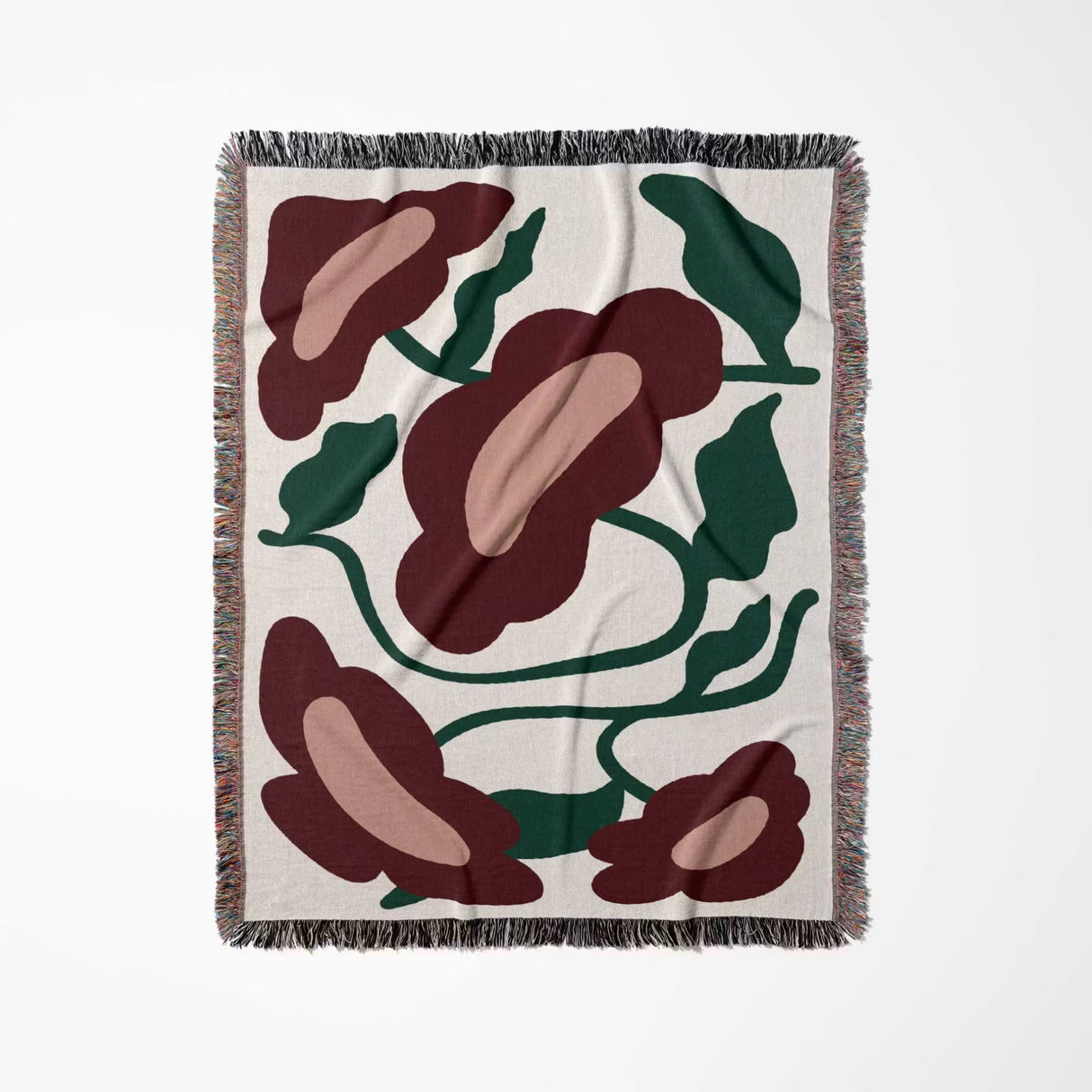 Floral patterned Matisse style red flowers cotton woven throw blanket with red and green flowers on a white background
