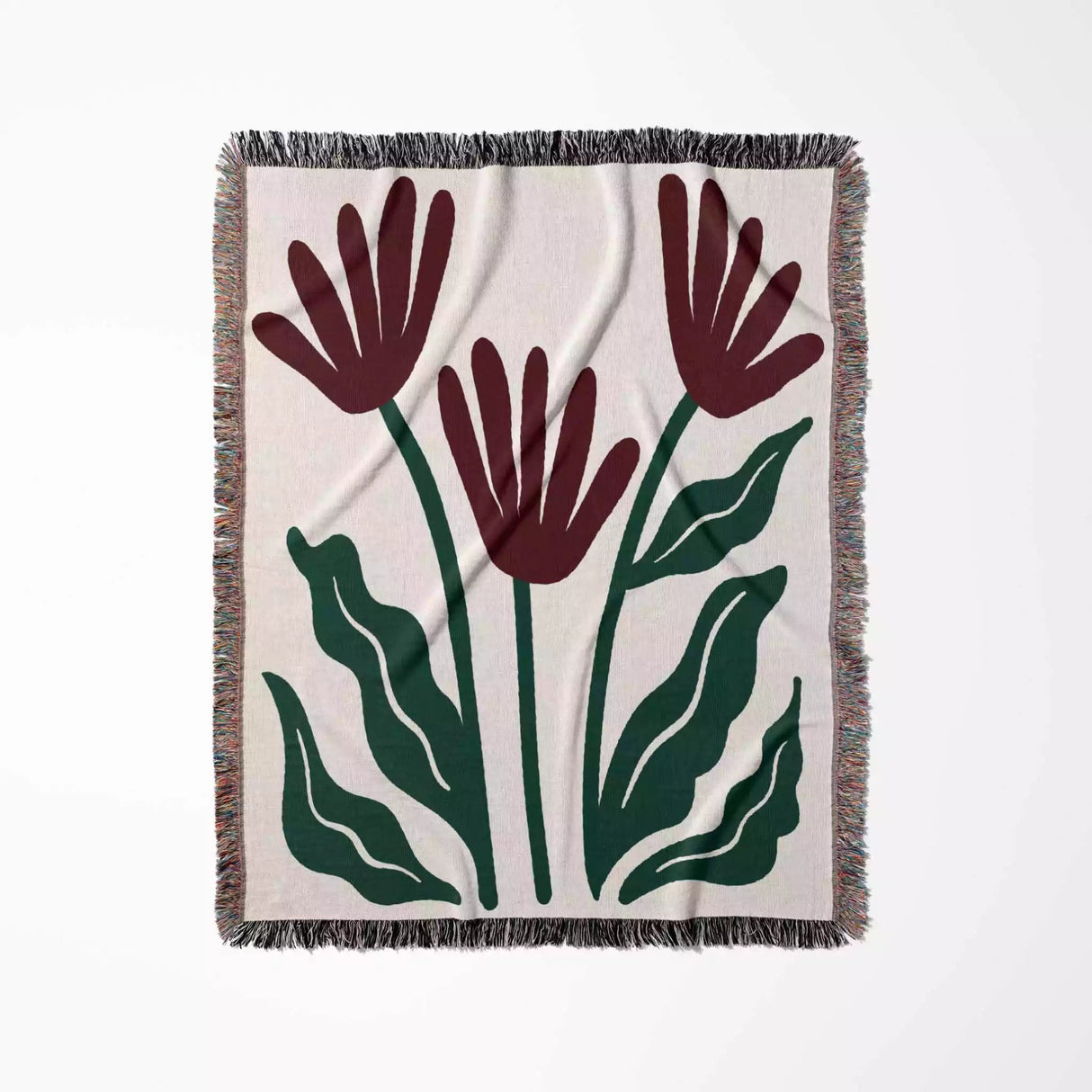 Floral patterned Matisse style red flowers woven throw blanket with red flowers and green leaves on a beige background