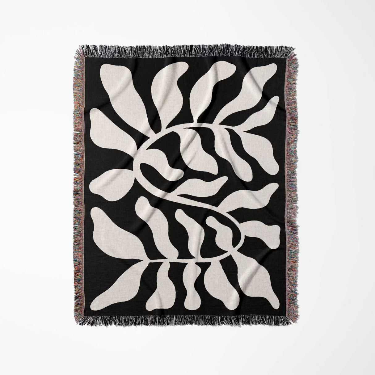 Black leaf Matisse throw blanket vertically flat on a white background