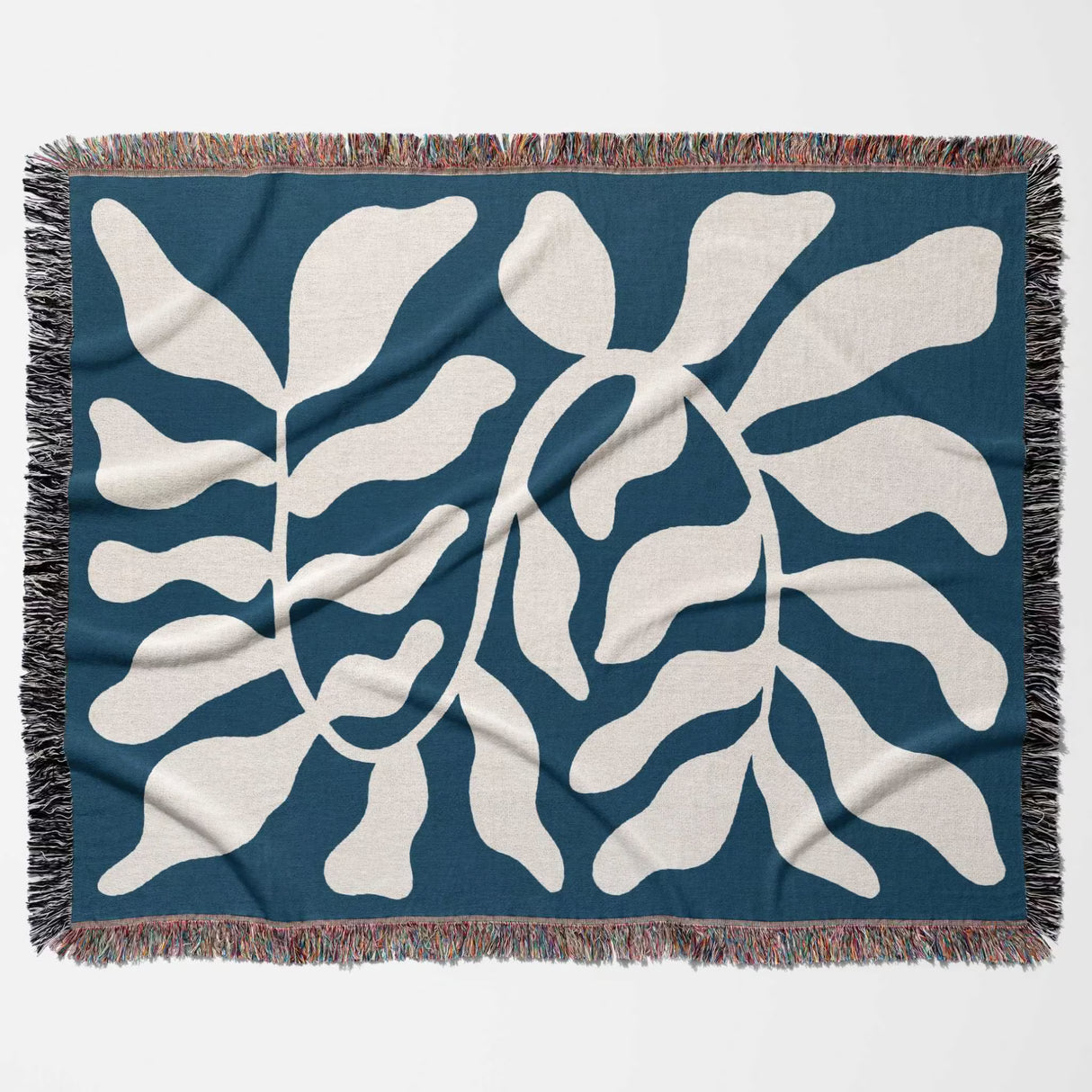 Blue leaf abstract woven Matisse trow blanket tapestry flat lay on a blue background