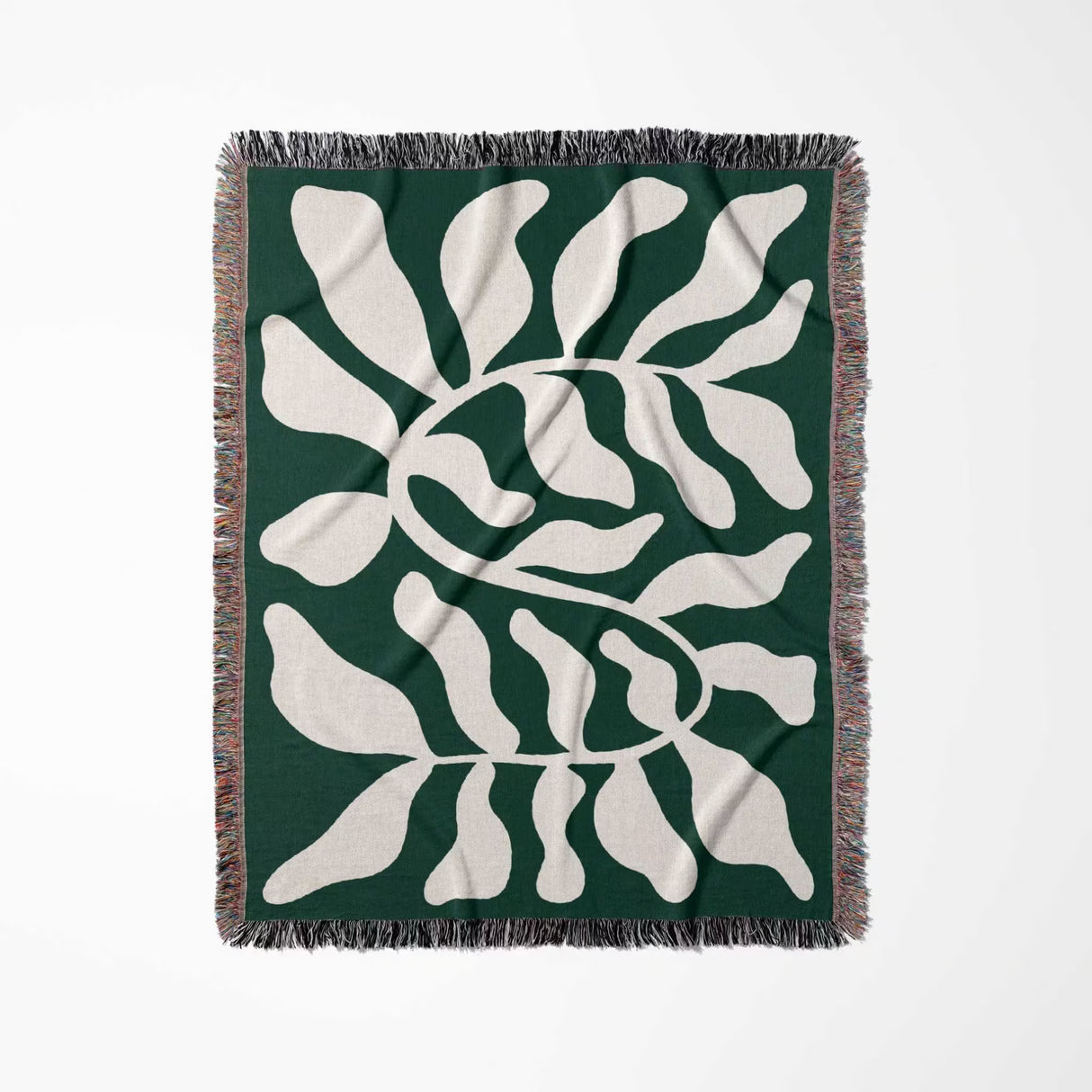 Matisse throw blanket green leaf abstract tapestry flat lay on a white background