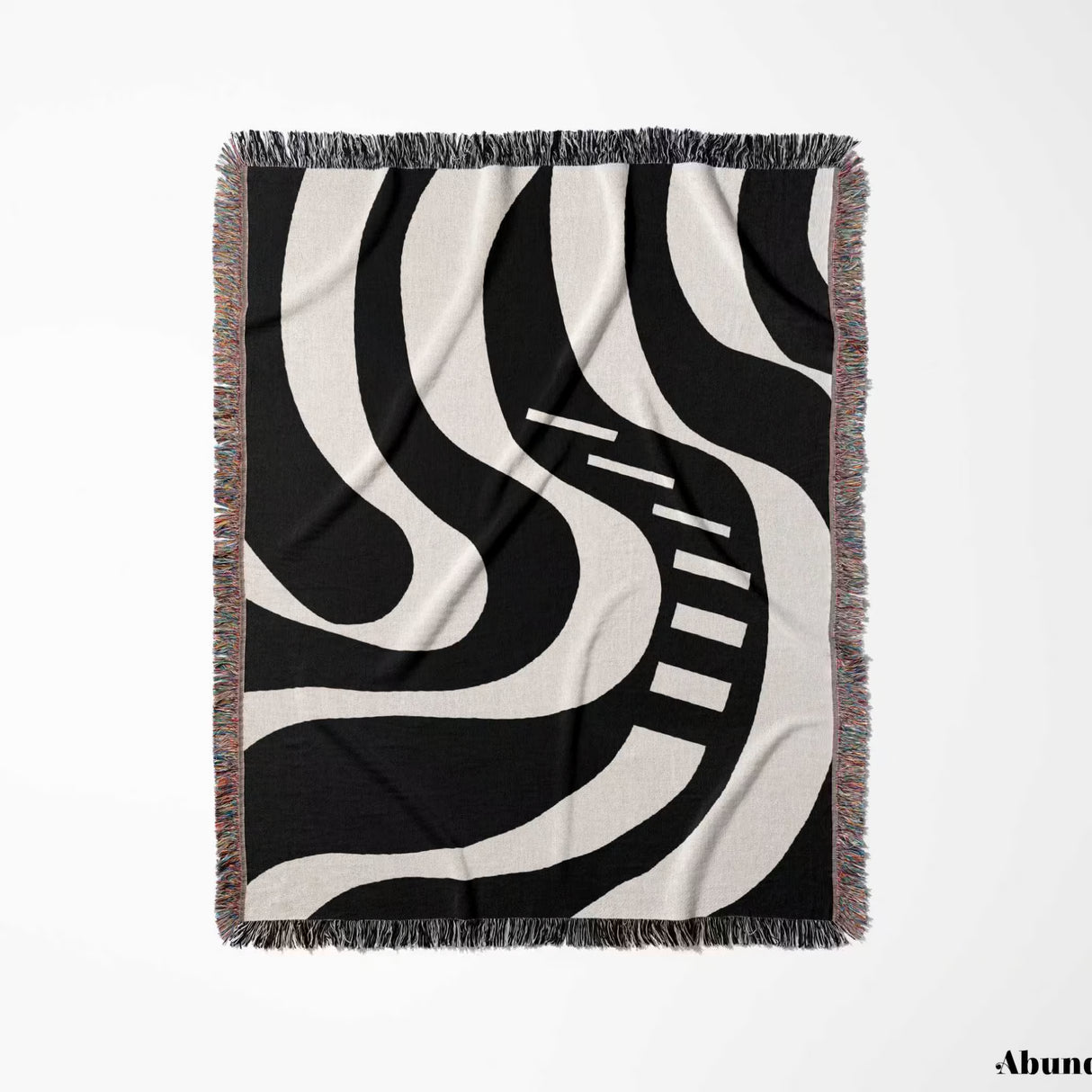 Black and white modern abstract art woven blanket throw tapestry full view with fringe on a white background.