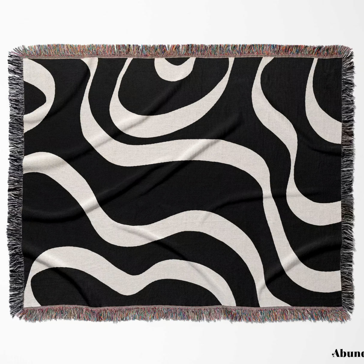 Black and white modern aesthetic waves woven blanket throw with fringed flat lay edges on a white background.