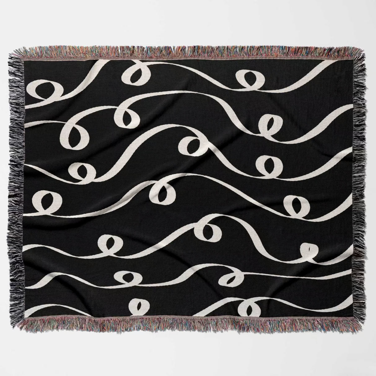 Black and white modern art decorative woven blanket throw tapestry flat lay on a white background