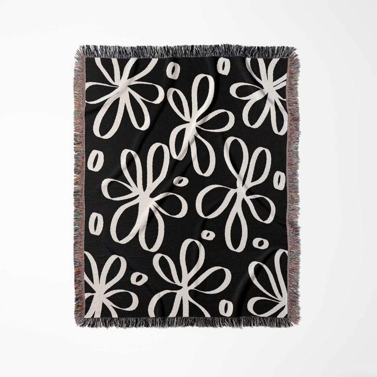 Black and white modern artsy flowers woven blanket throw full view on a white background.