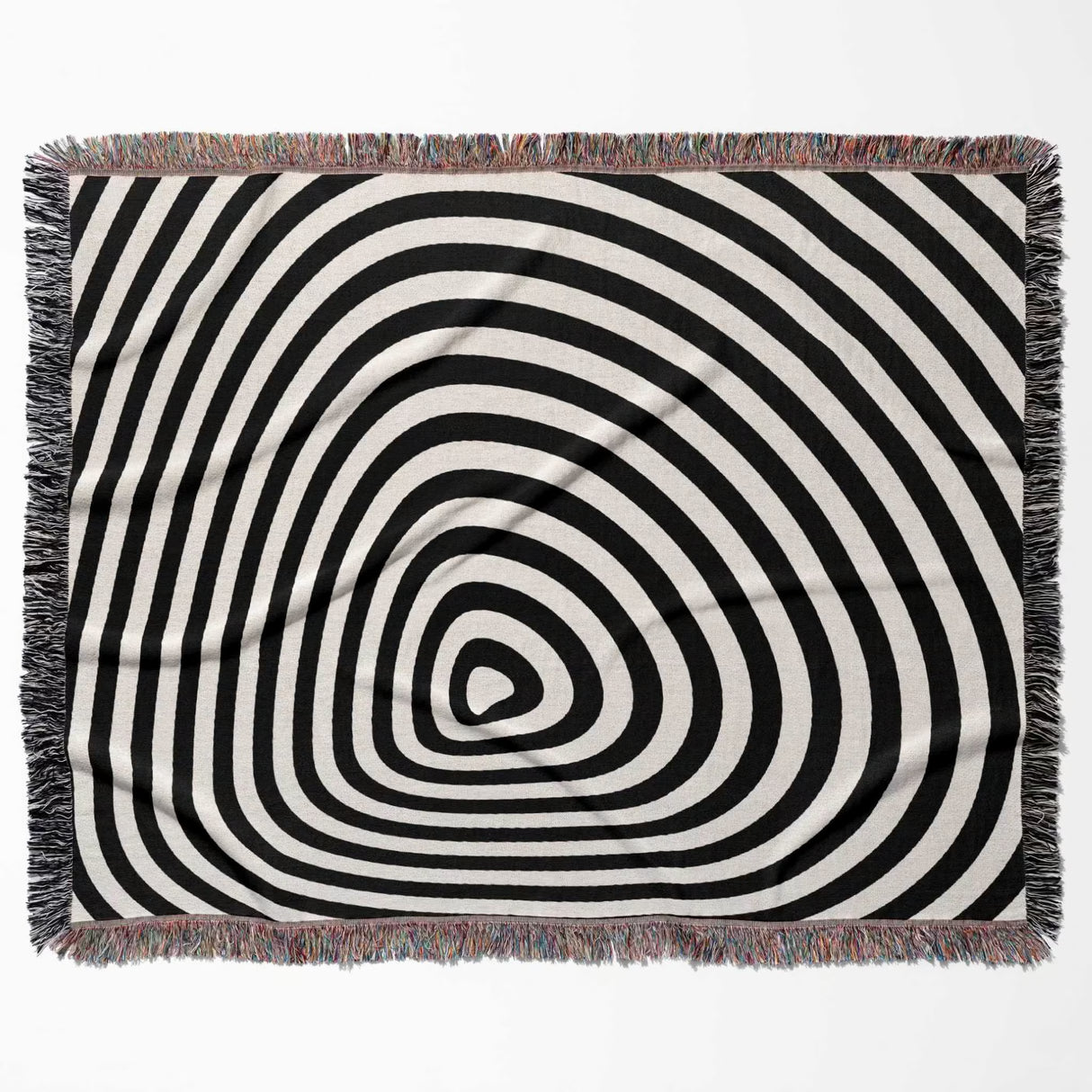 Black and white optical illusion hole woven blanket throw tapestry flat lay on a white background.