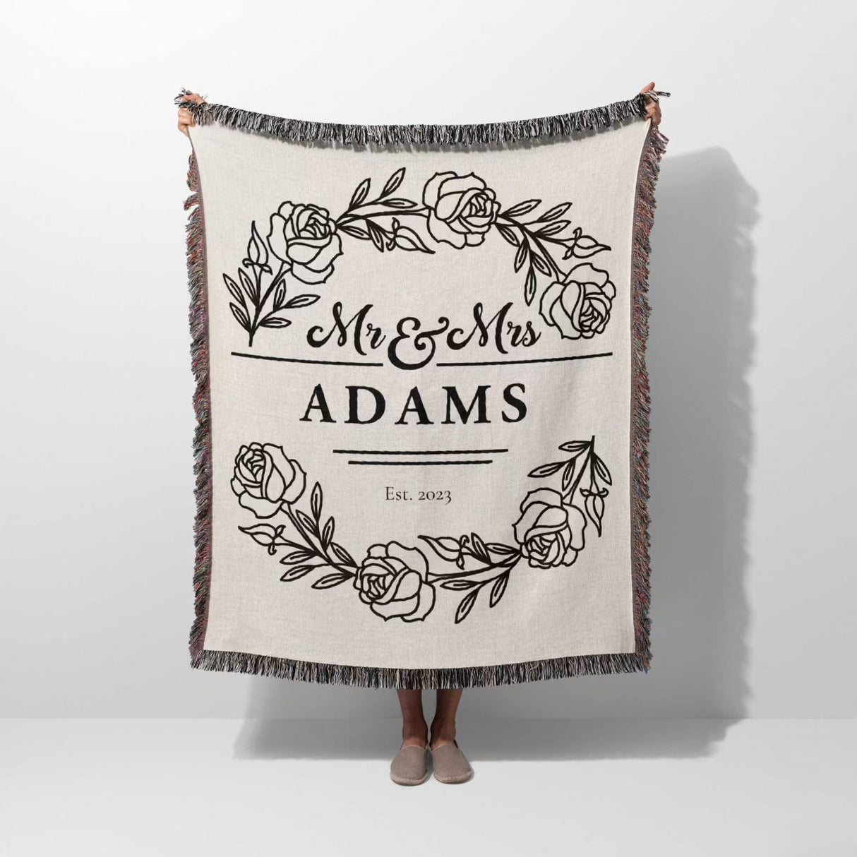 Personalized 2 year anniversary gift - Mr and Mrs woven throw blanket with 'Mr & Mrs Adams' design on a white background