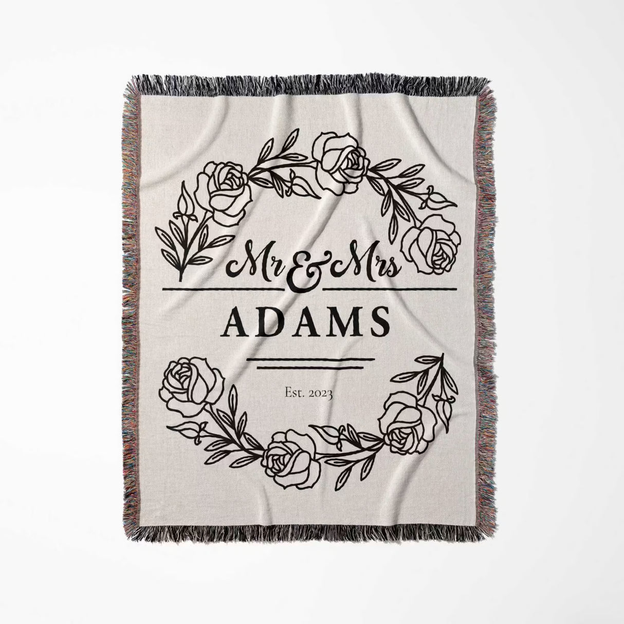 Personalized 2 year anniversary gift - Mr and Mrs woven throw blanket with floral design and 'Mr & Mrs Adams' text full view on a white background
