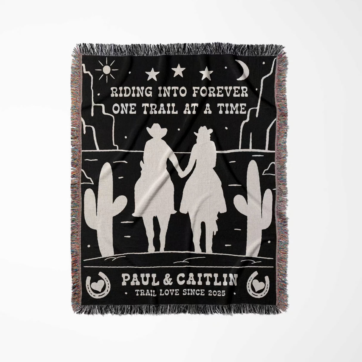 Personalized cowboy and cowgirl 2nd anniversary gift woven throw blanket full view with desert landscape design, silhouettes of a couple, and text on a black background.