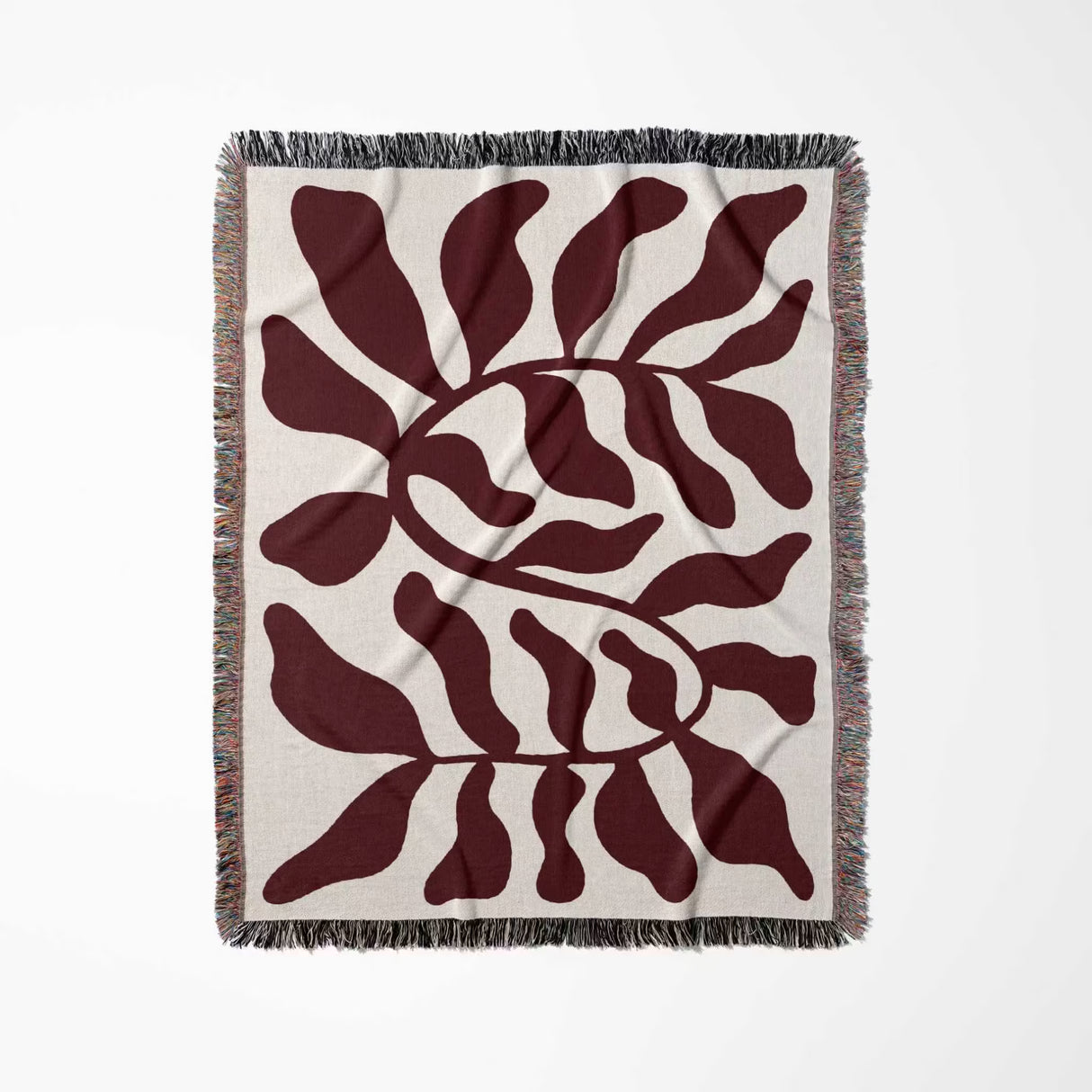Red leaf Matisse throw blanket flat lay vertically on a white background