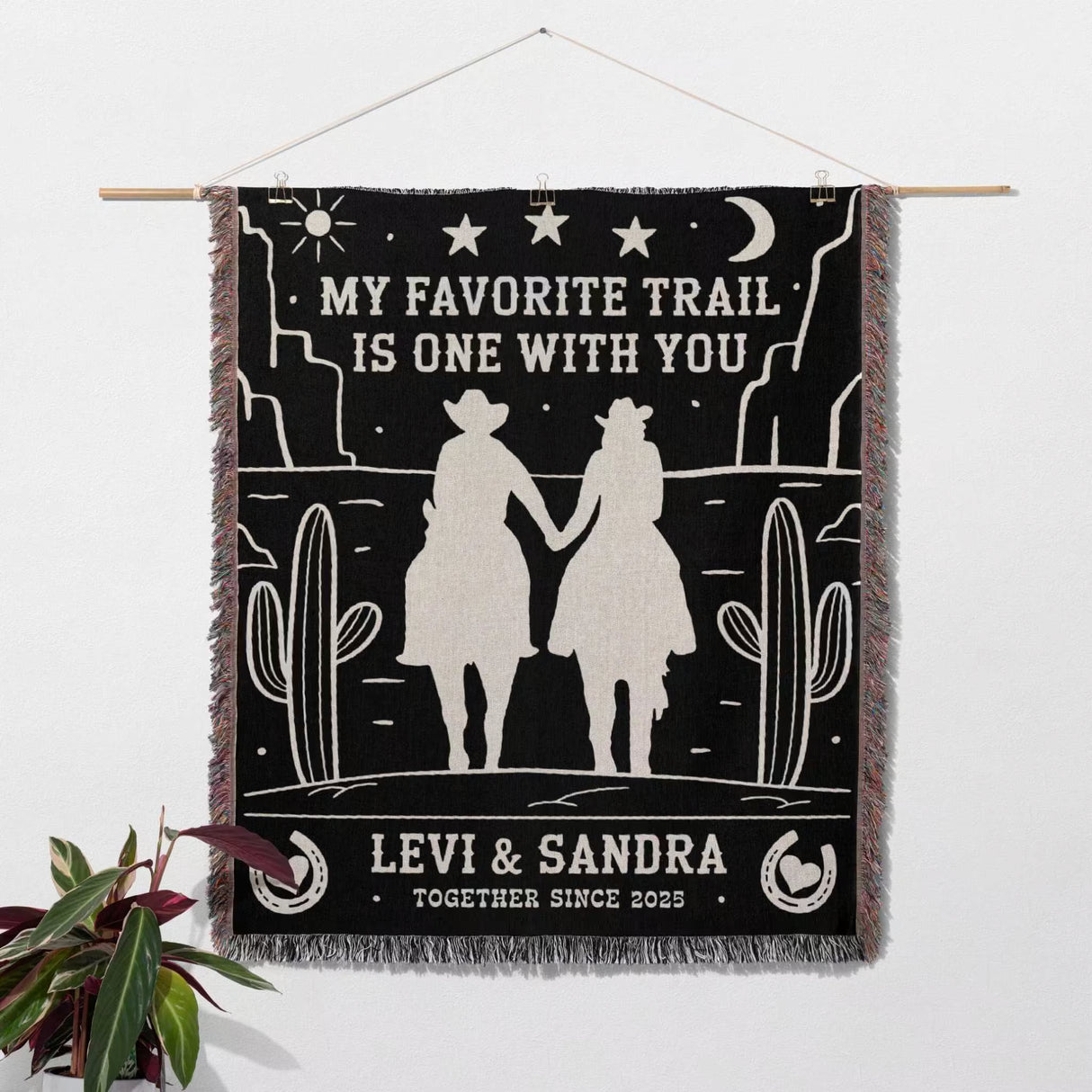 Romantic cowboy and cowgirl 2nd anniversary gift woven throw blanket with desert western design, couple holding hands, and text 'My favorite trail is one with you' on a white background.