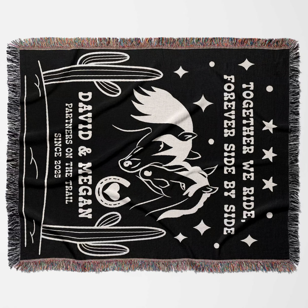 Romantic western 2nd anniversary gift - woven throw blanket flat lay with white horse design, text, and fringes on a gray background