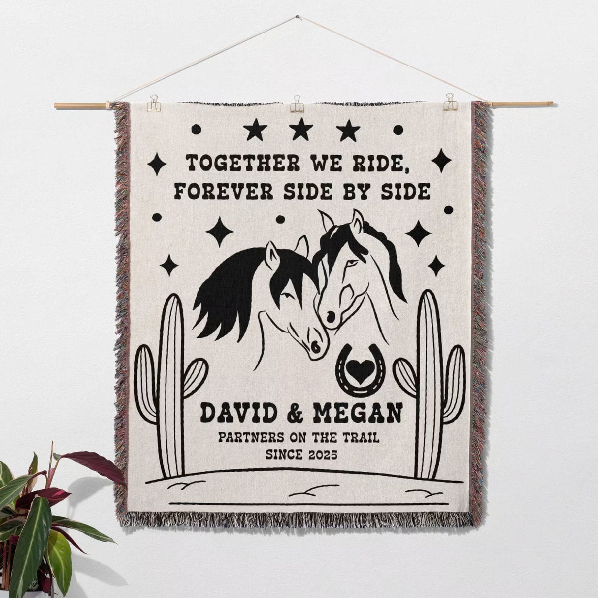 Romantic western cotton anniversary gift - woven throw blanket as a wall hanging with horses, cacti, and text on a white background
