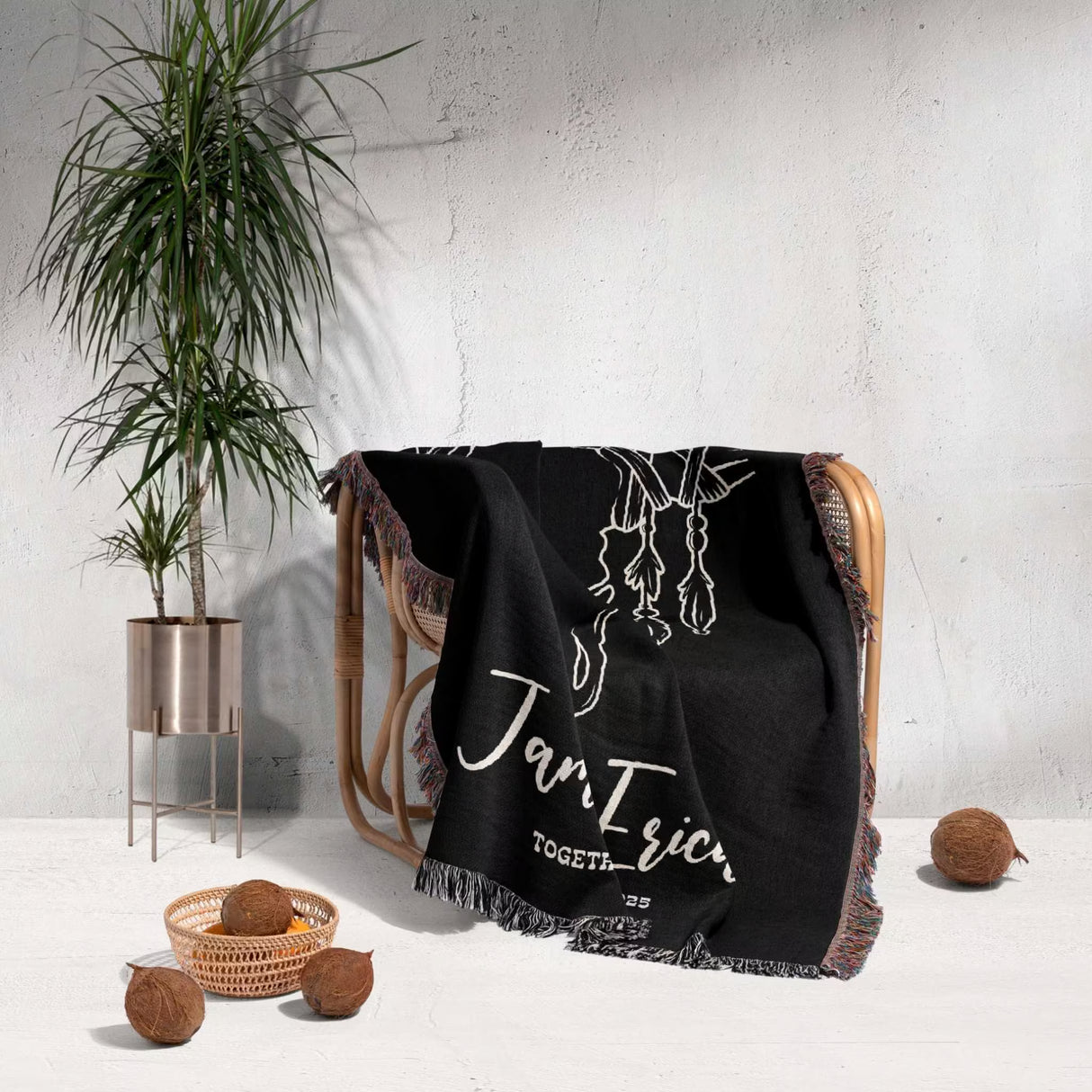 Rustic bull skull 2nd anniversary gift woven throw blanket with white text draped over a chair in a room with a plant and decorative items.