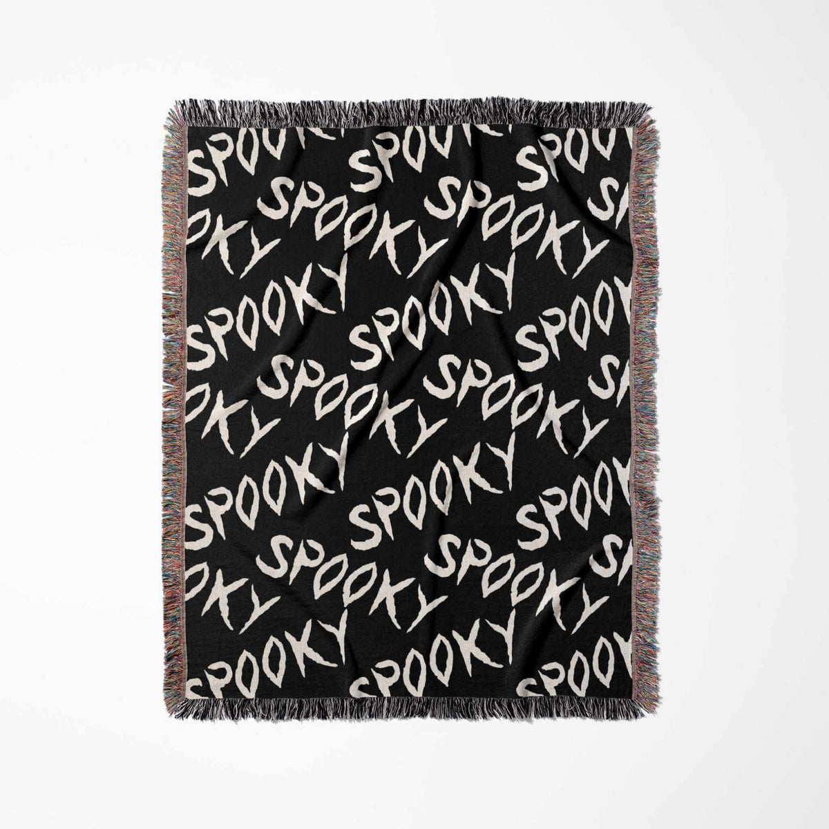 Black blanket with 'Spooky' text pattern on a white background