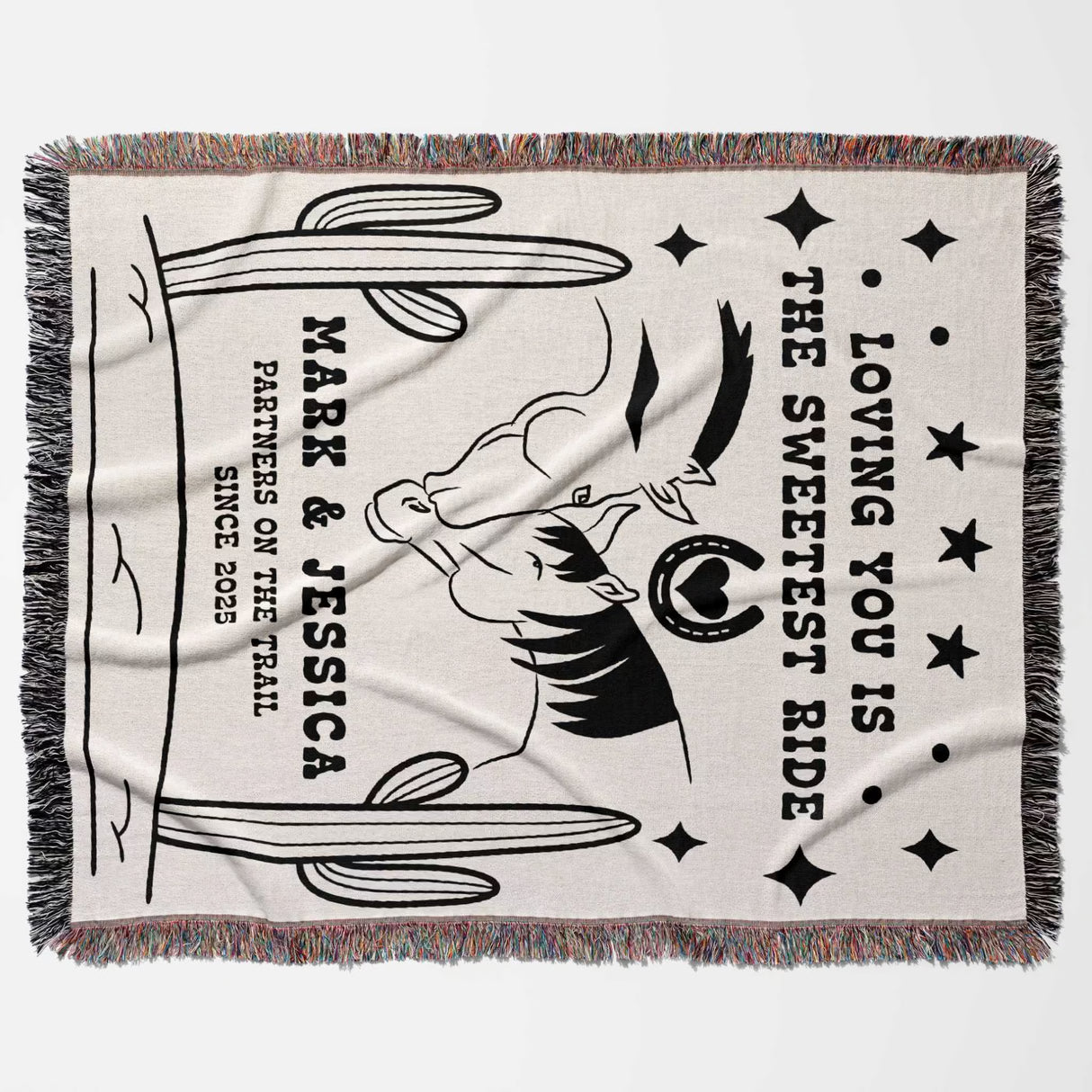 Two horses woven throw blanket cotton anniversary gift flat lay with black and white graphic design featuring text and a horse, on a light background.