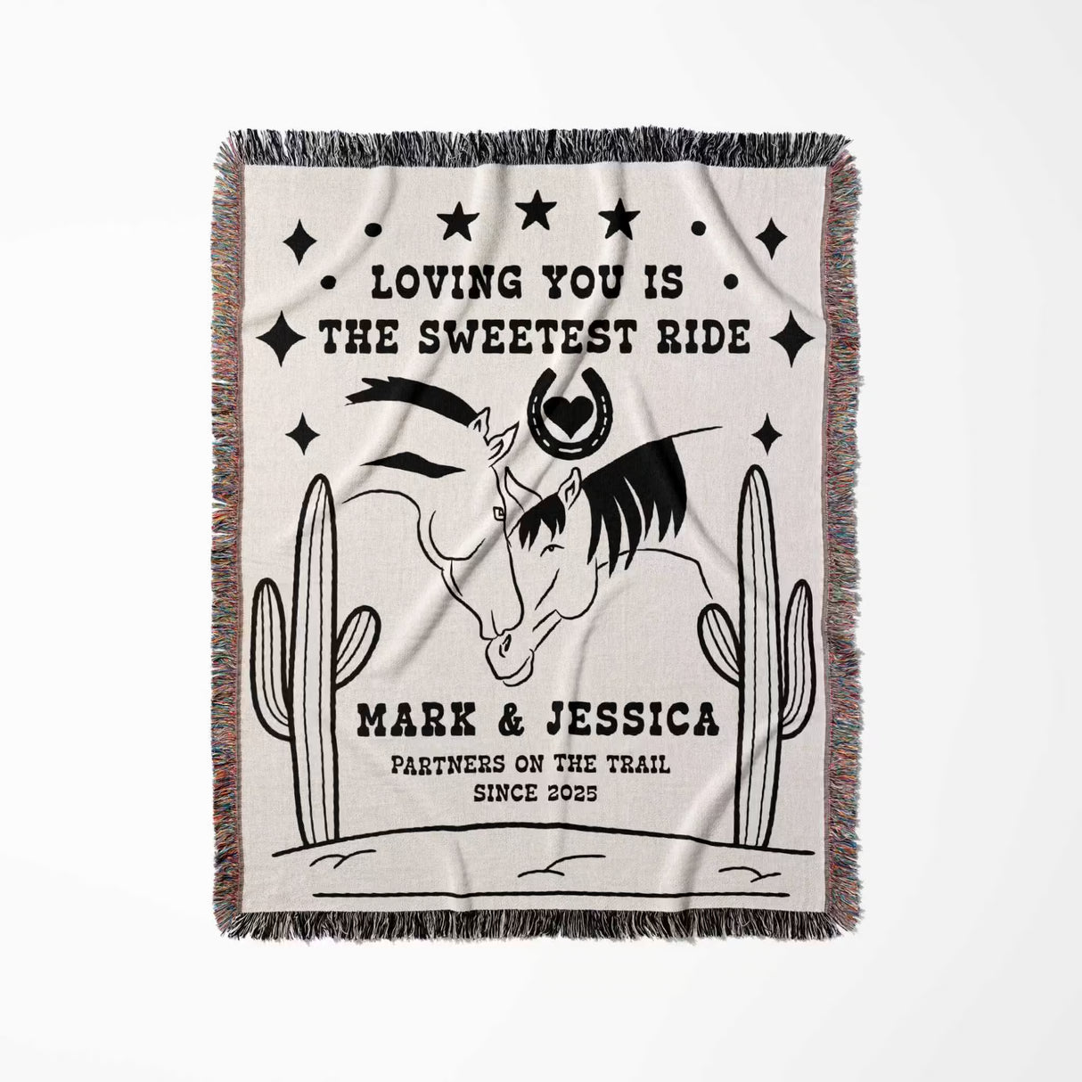Two horses woven throw blanket cotton anniversary gift full view with horses and cactus design, text 'Loving you is the sweetest ride' and personalized names.