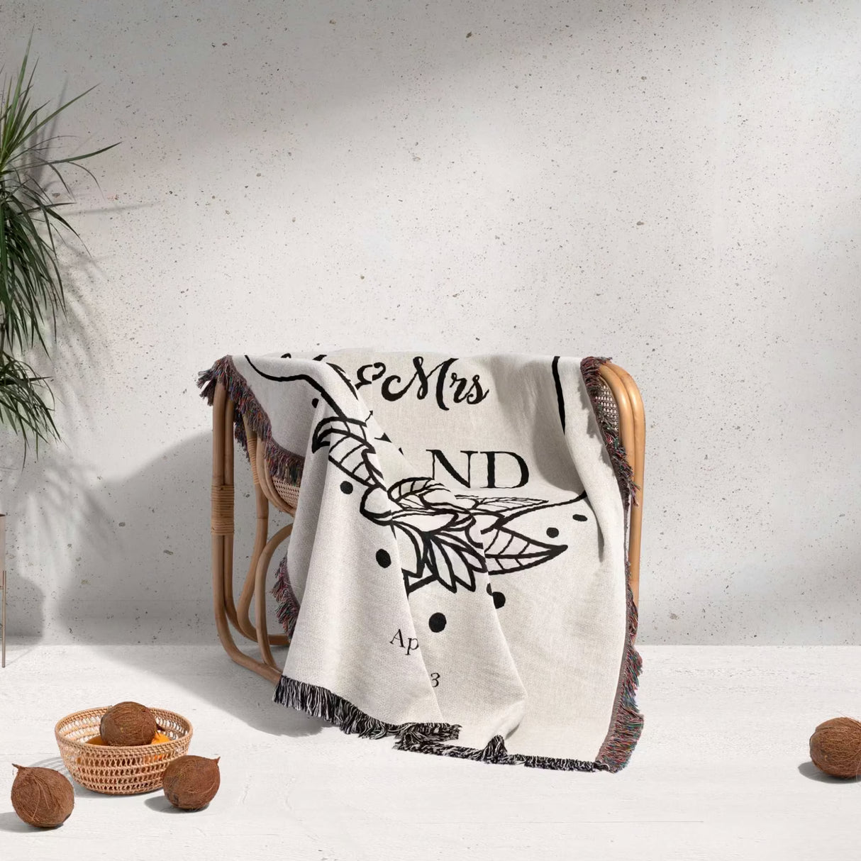 2nd year anniversary gift Mr and Mrs woven throw blanket with decorative text and patterns draped over a chair against a light background