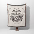 2nd year anniversary gift Mr and Mrs woven throw blanket with 'Mr & Mrs Rowland' design held by a person on a white background