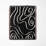 Black and white abstract art waves decorative woven blanket throw full view on a white background