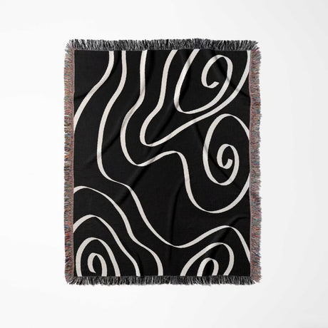 Black and white abstract art waves decorative woven blanket throw full view on a white background