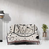 This image displays an Aquarius Zodiac Sign Blanket draped over a couch. The woven tapestry blanket features a black-and-white illustration of an Aquarius woman, adorned with stars and constellations. Ideal for enhancing your living space with astrological charm, it offers both aesthetic appeal and comfort.