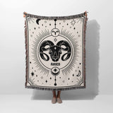 Held vertically, this Aries Zodiac Blanket displays its full design with the ram's head and celestial motifs. The high-quality woven craftsmanship and multicolor fringe are evident, making it a perfect personalized birthday gift for Aries individuals.