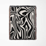 Black and white marble woven throw blanket for couch with black and white design on a white background