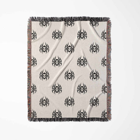 Blanket with black geometric pattern on beige background